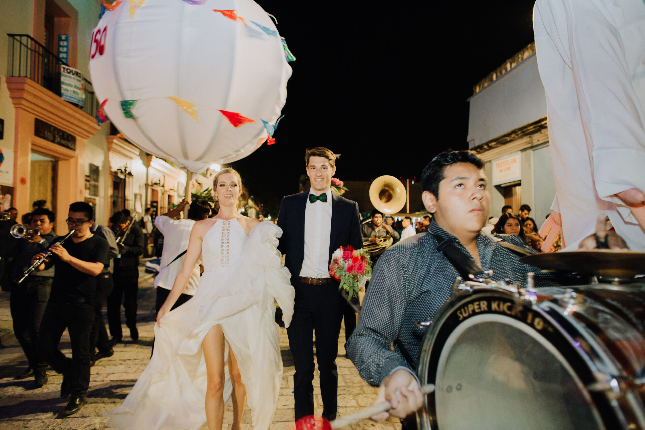 stunning bride and groom pose in the streets of Oaxaca after their dreamy wedding 