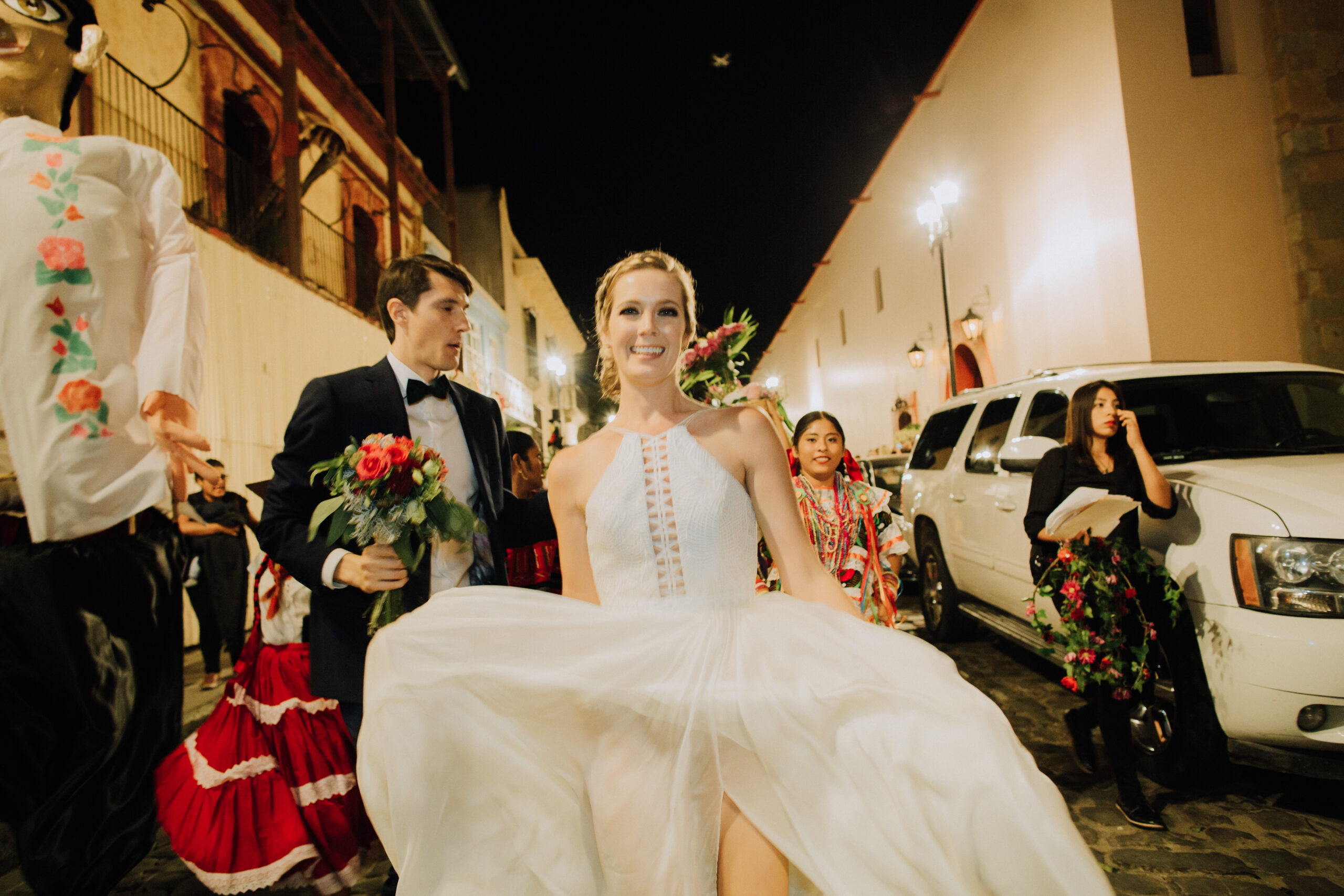 stunning bride and groom pose in the streets of Oaxaca after their dreamy wedding 