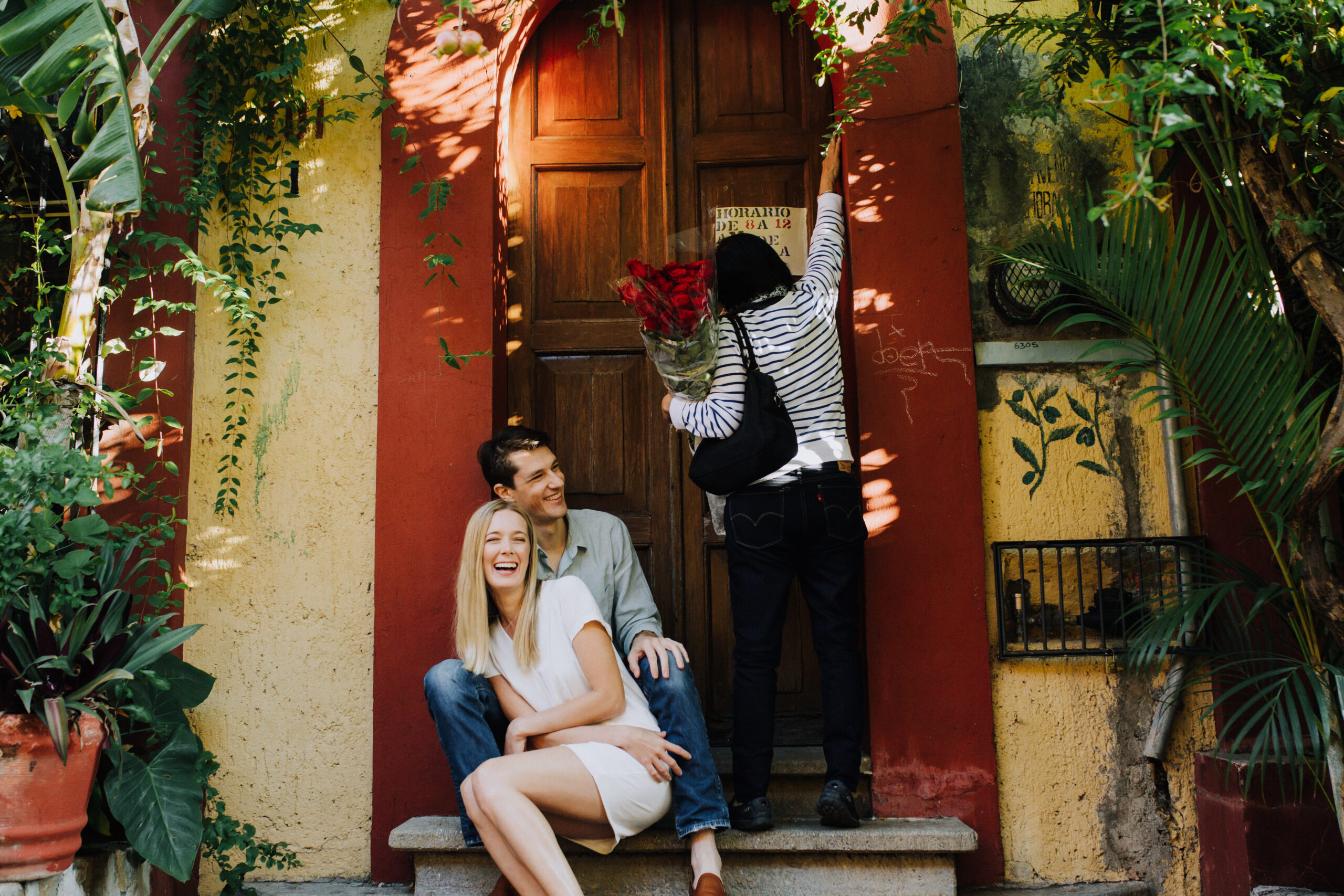 beautiful couple take candid photos during their Oaxaca engagement photoshoot 
