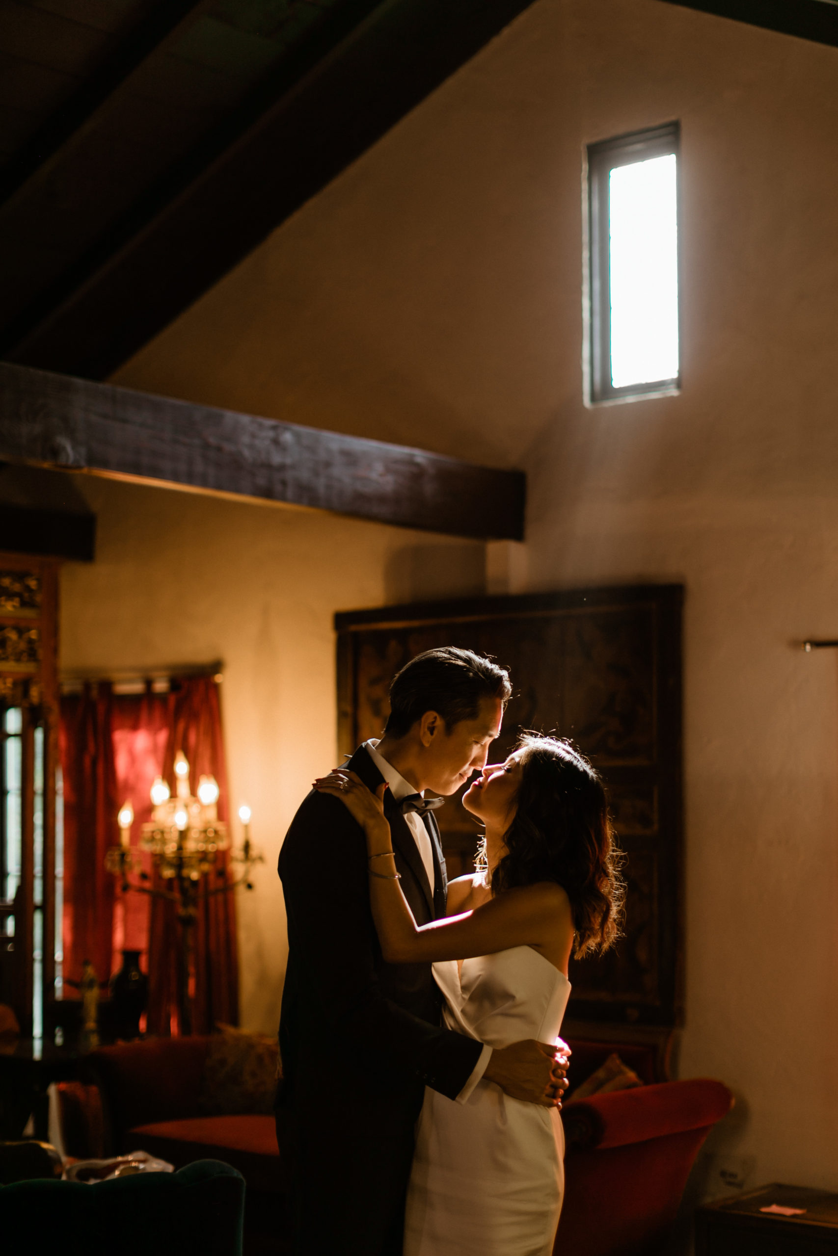 bride and groom pose together inside their stunning LA home
