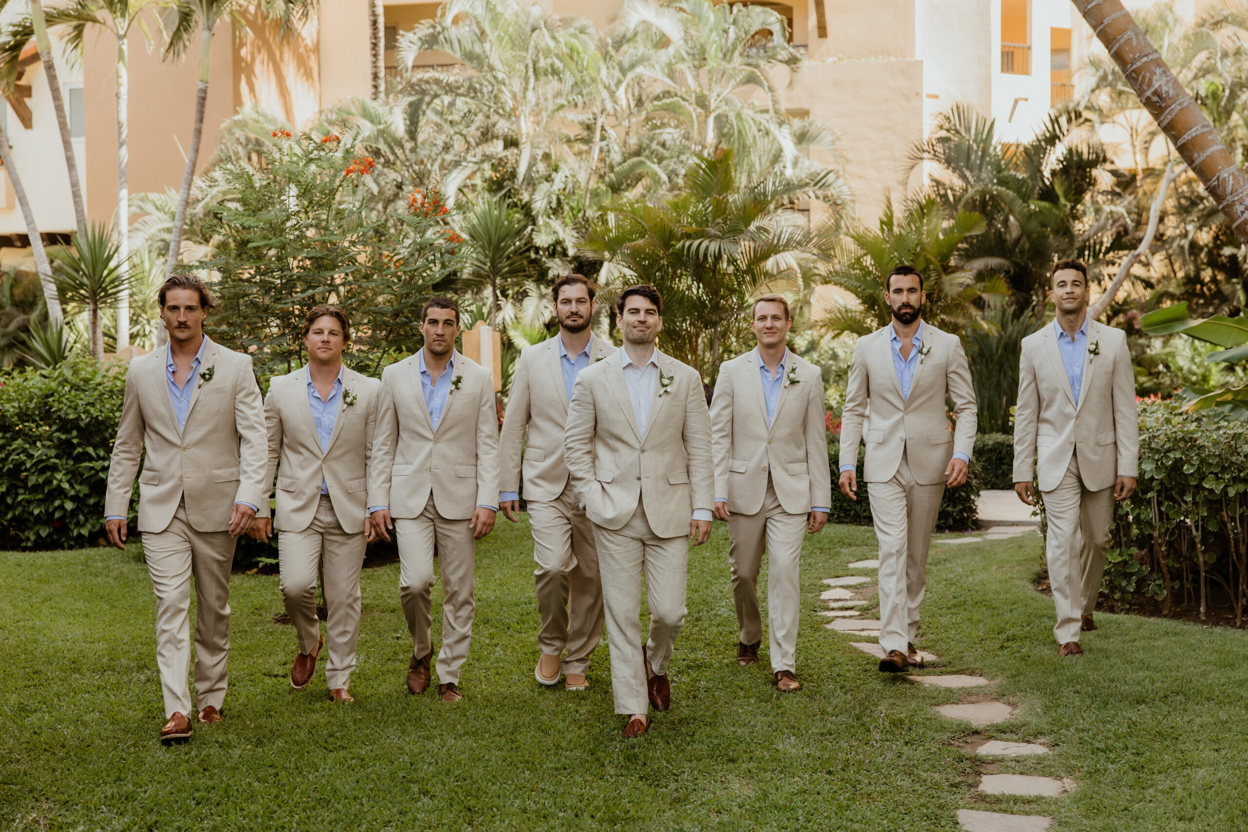 groomsmen lined up on puerto vallarta wedding venue.