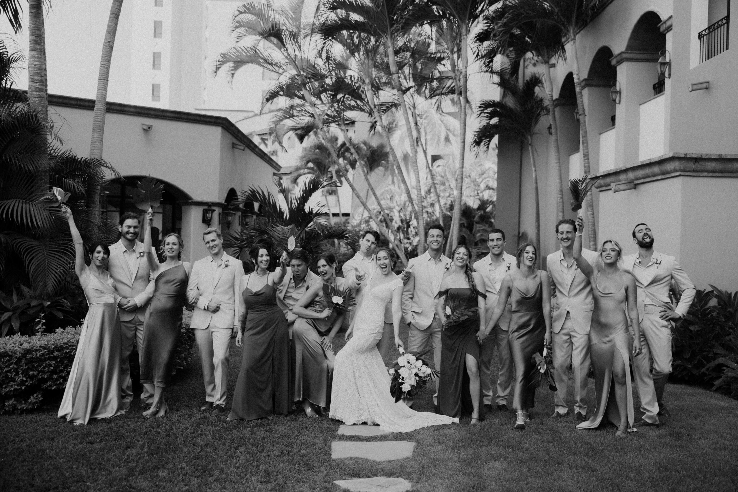black and white bridal party posing together.