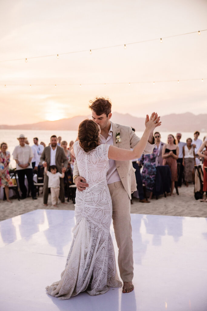 bride and groom dancing at destination beach wedding.