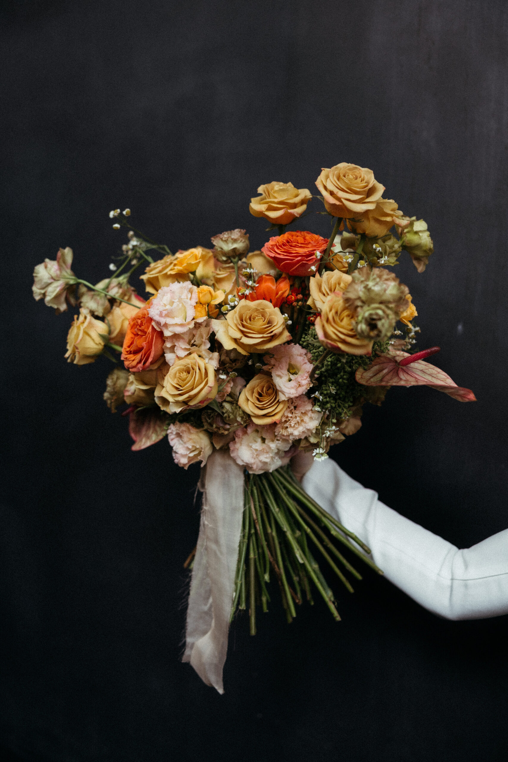A bride takes a photo with her bouquet before her dreamy wedding in Mexico City, Mexico!