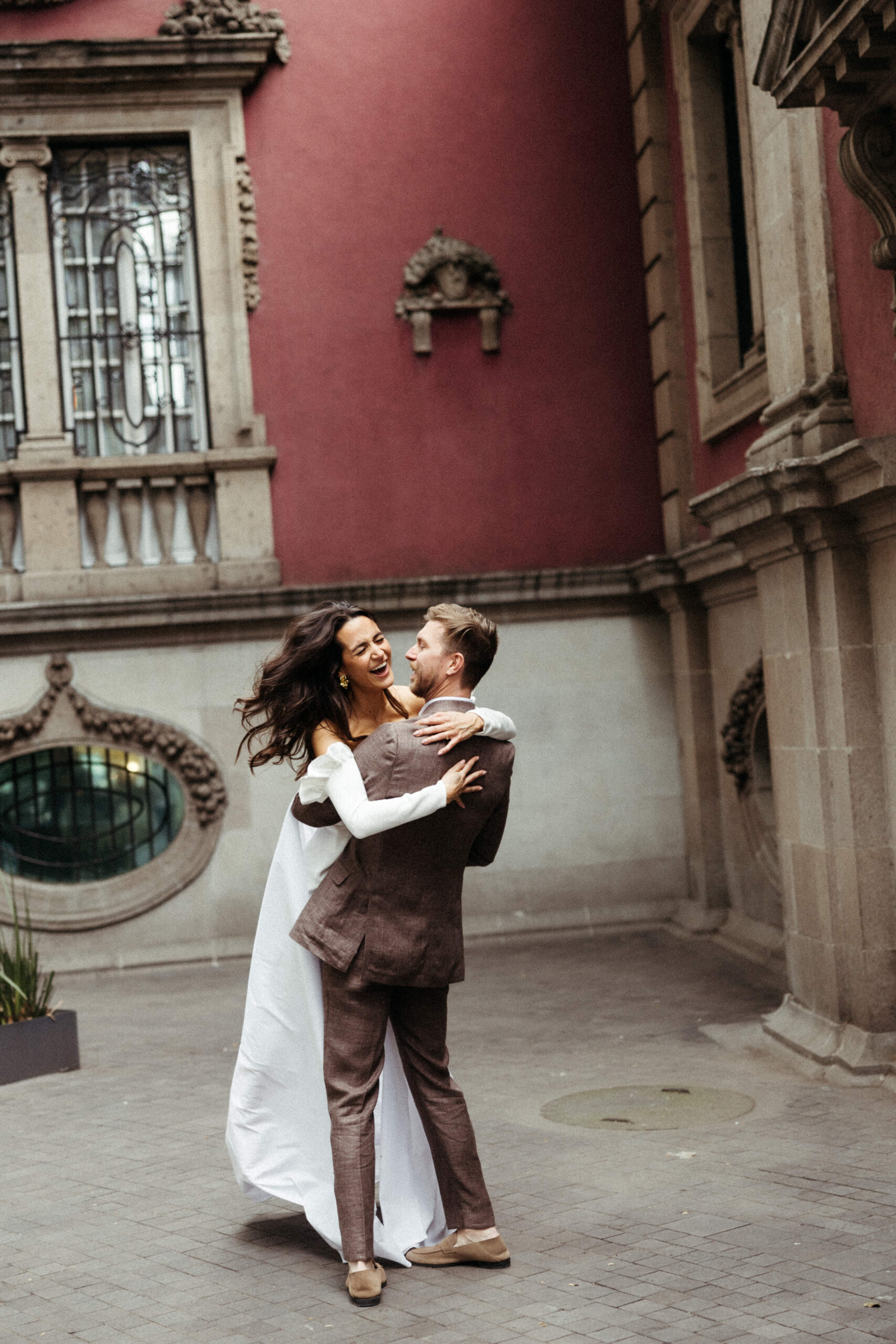 Beautiful bride and groom take photos with the historic Mexico City, Mexico buildings in the background! 