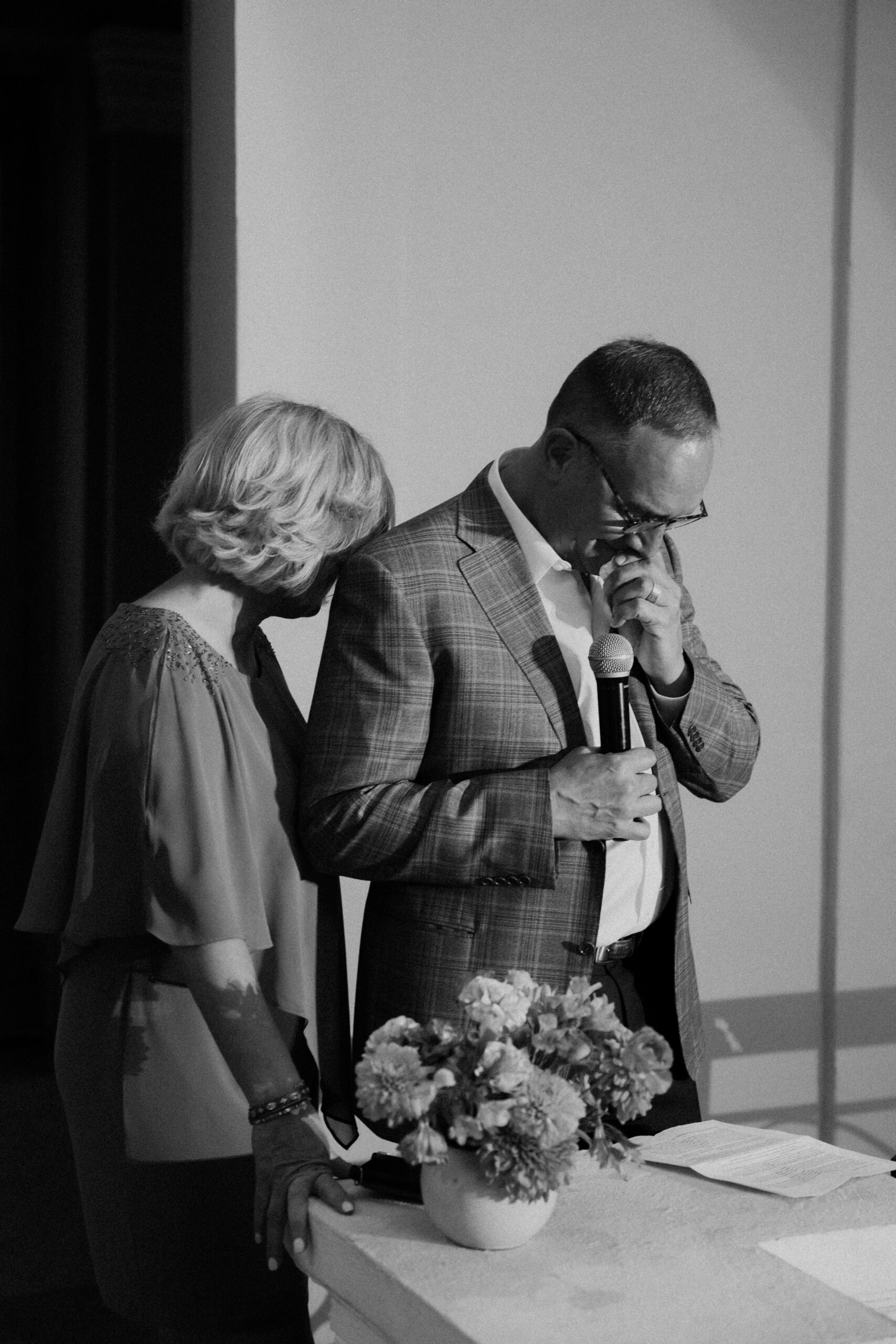 mother and father of the bride giving emotional speech
