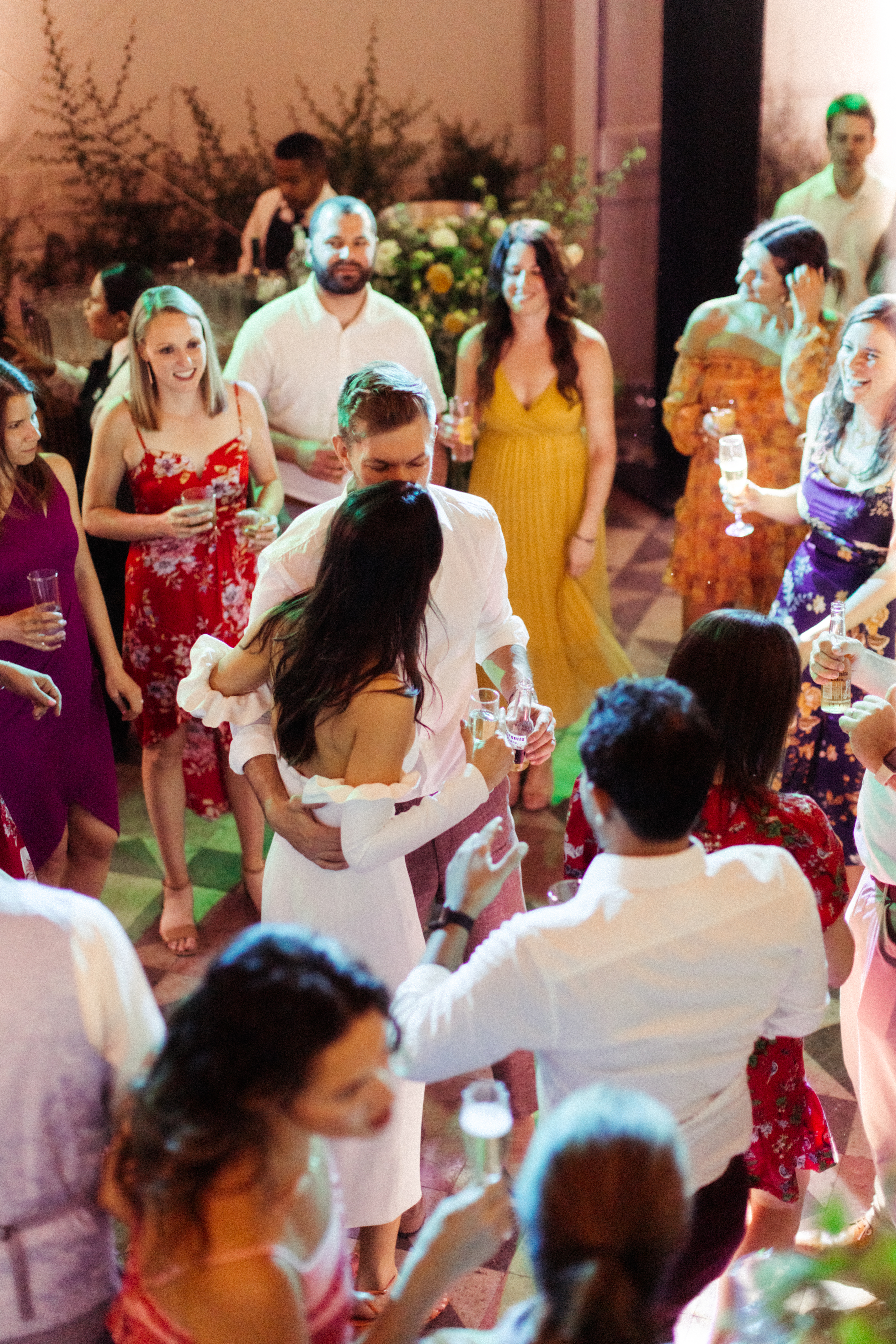 Bride and groom share a moment on the dance floor surrounded by their family and friends! 