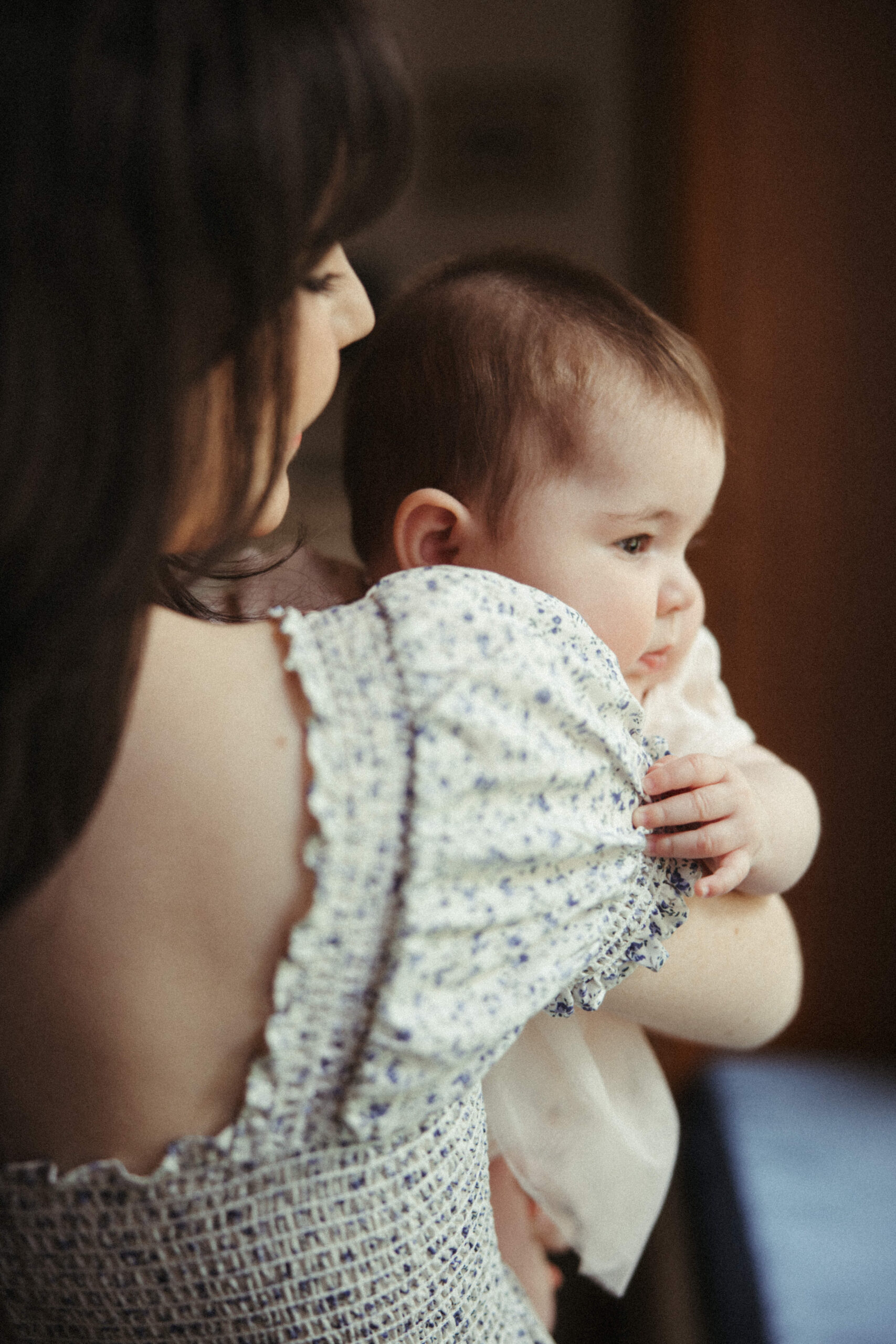 intimate photo of mom and infant daughter together during their in home photo session