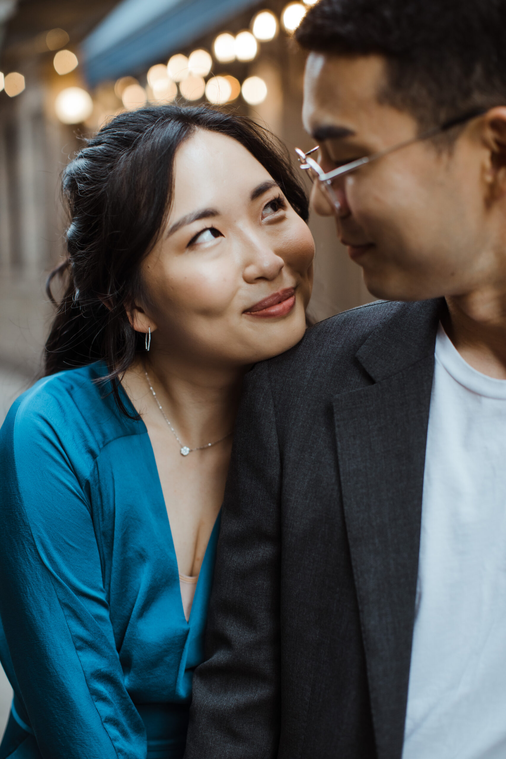Beautiful fiance lovingly looks at her fiance during their West Village engagement photos