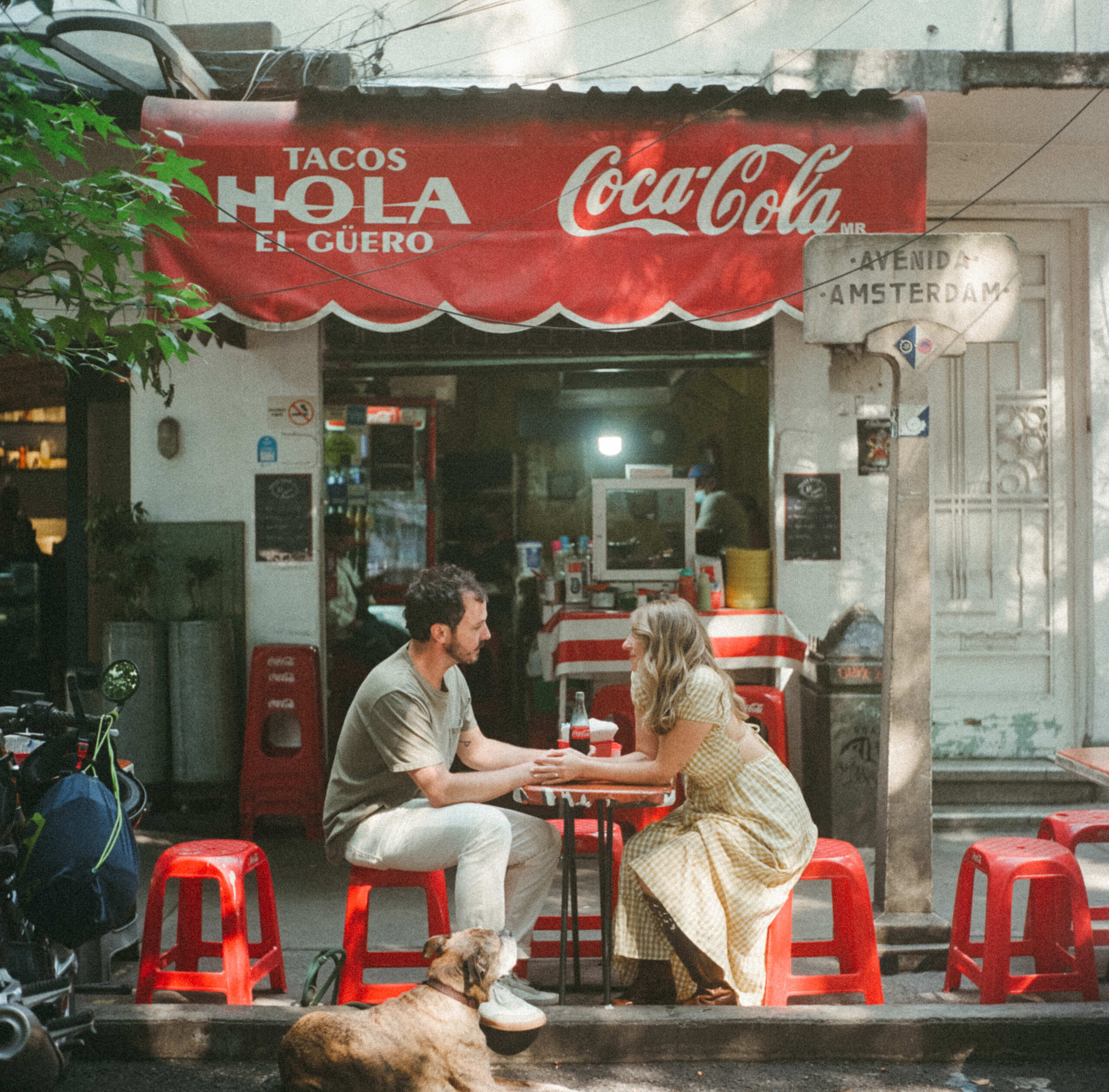 vintage vibe of man and woman sipping on a coca cola at local diner.