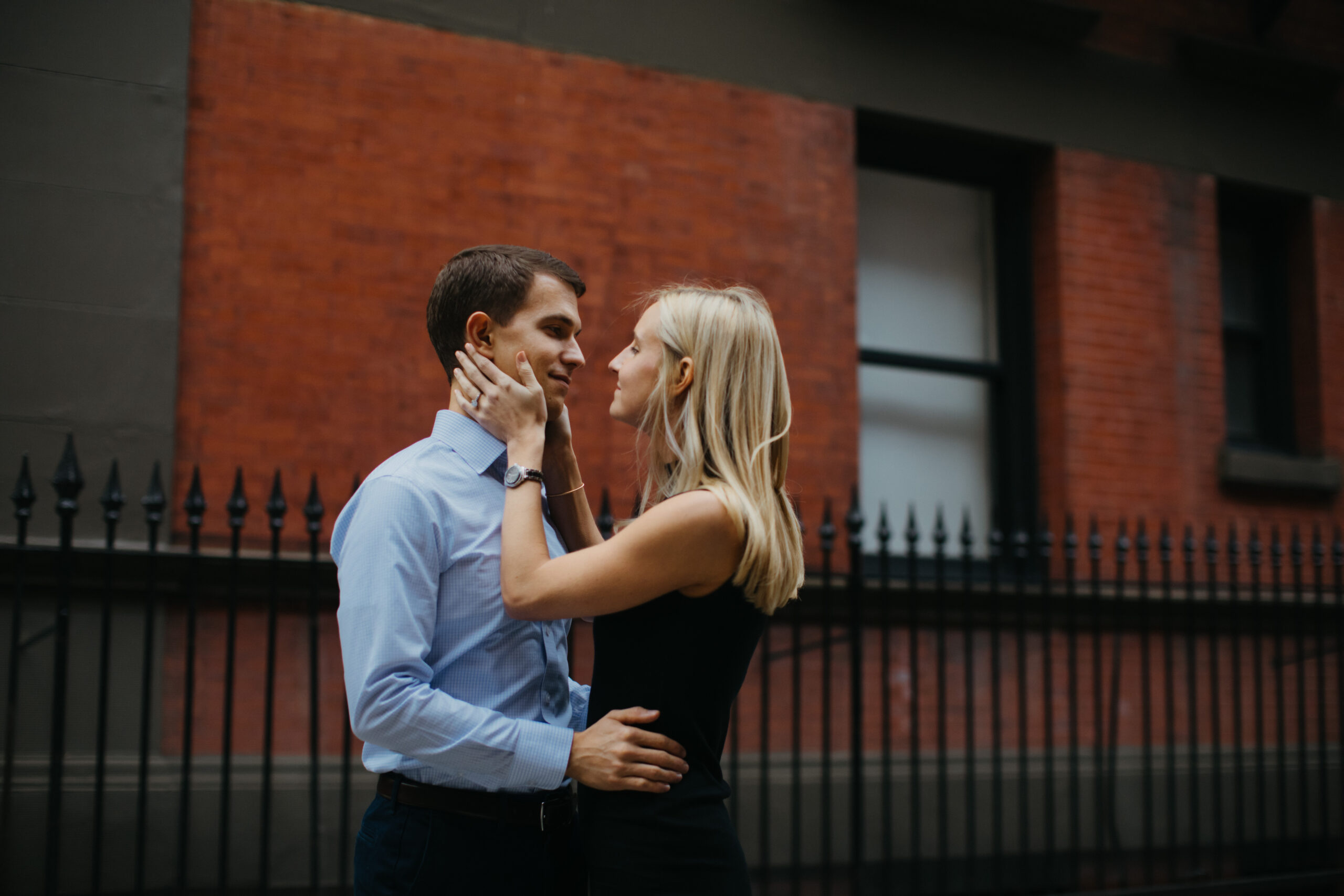 Beautiful couple shares an intimate moment during their West Village New York engagement photo session