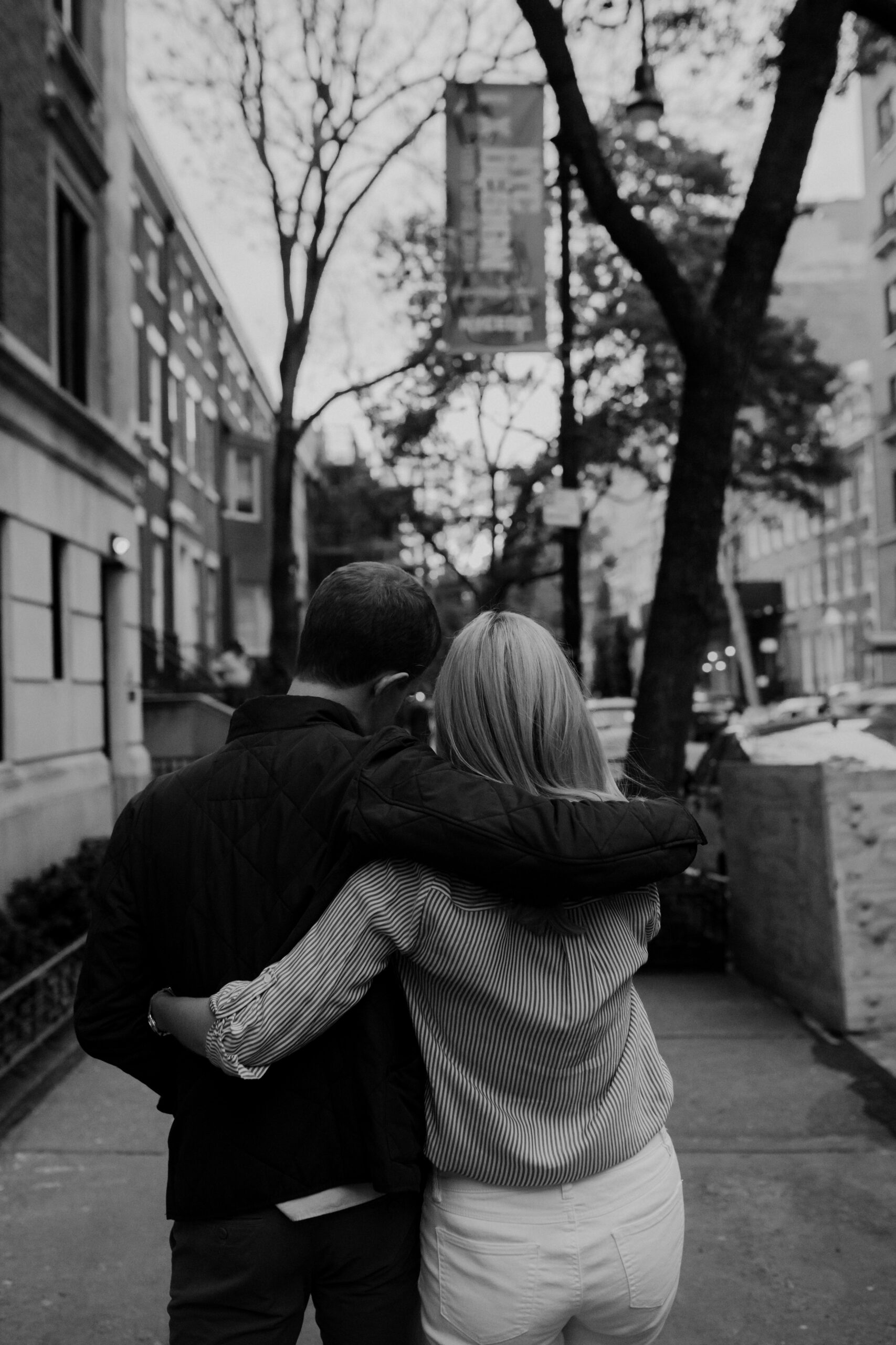 Stunning couple walk together in the West Village during their dreamy New York Engagement photoshoot