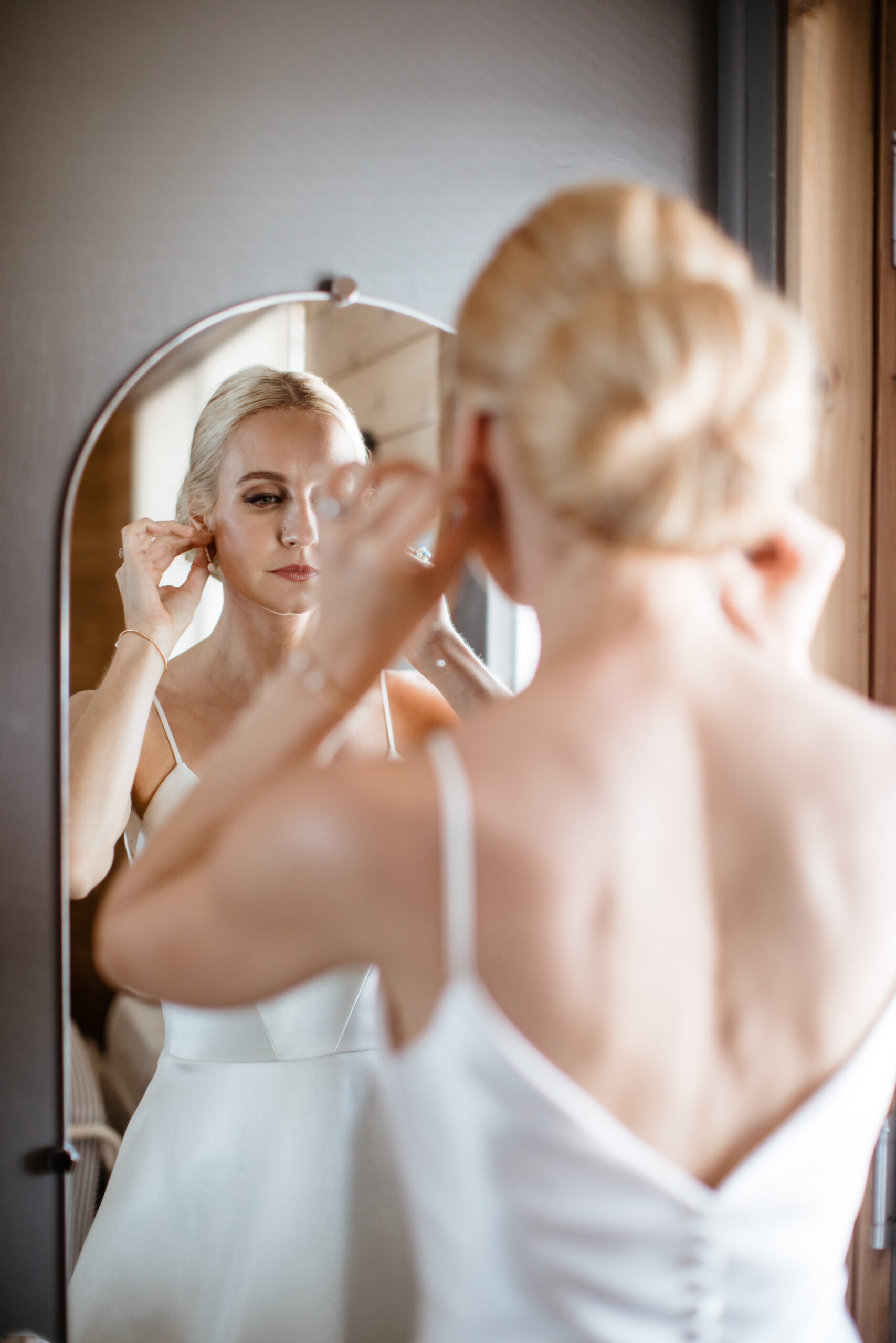 Stunning bride adds her final touch to prep before her winery wedding day!