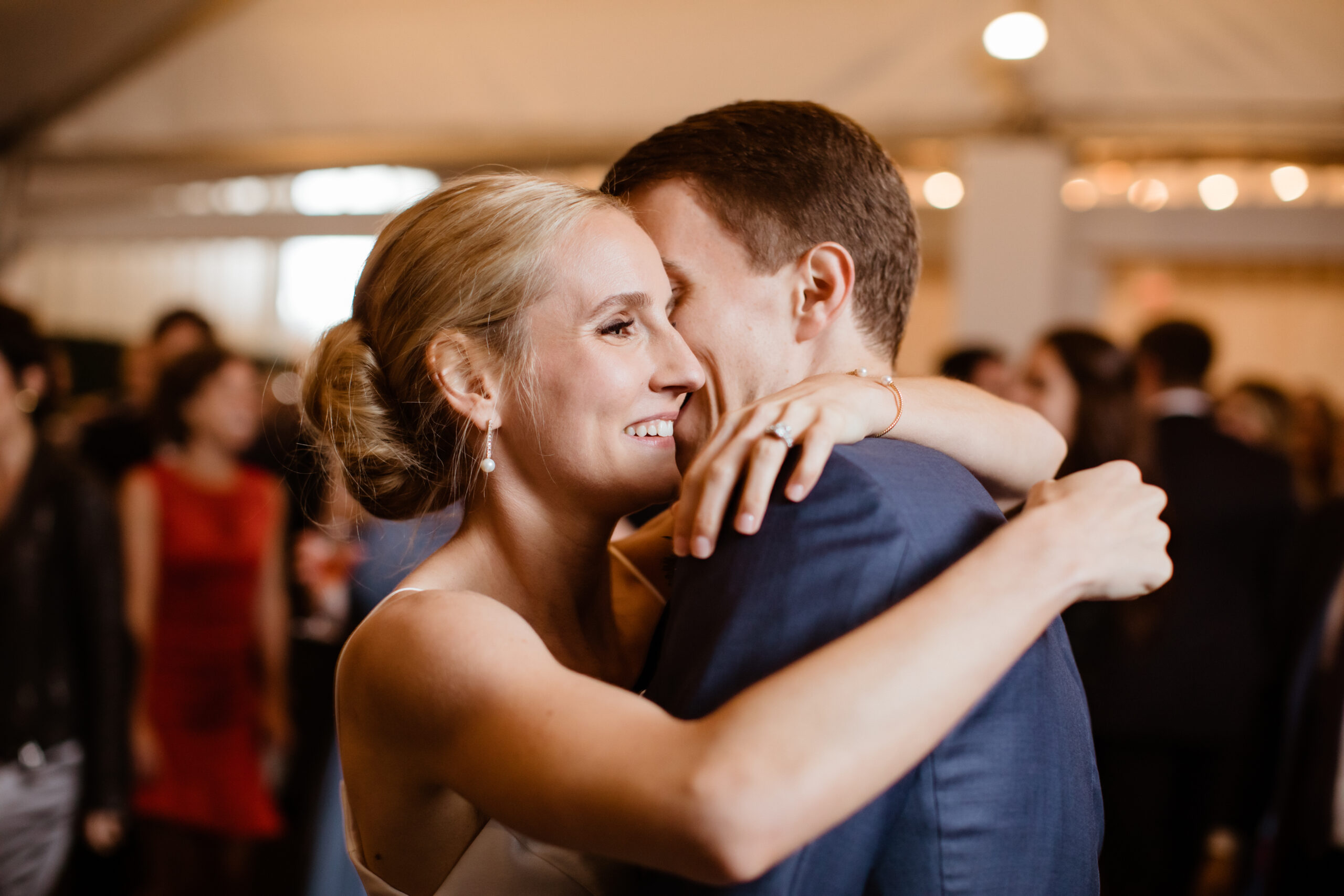 Bride and groom share a hug during their dreamy Bedell Winery wedding