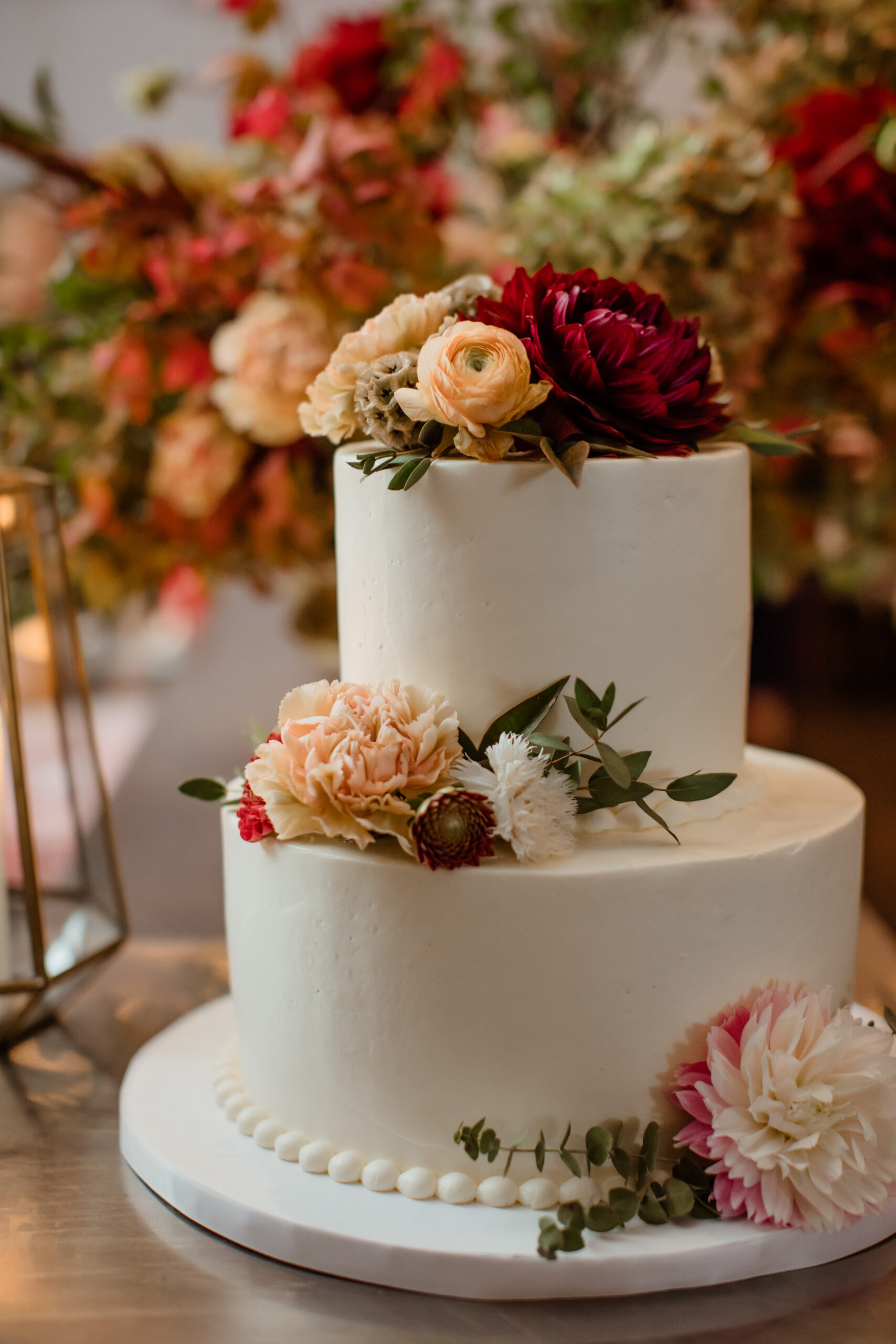 Beautiful wedding cake decorated with florals at a Bedell Cellars wedding