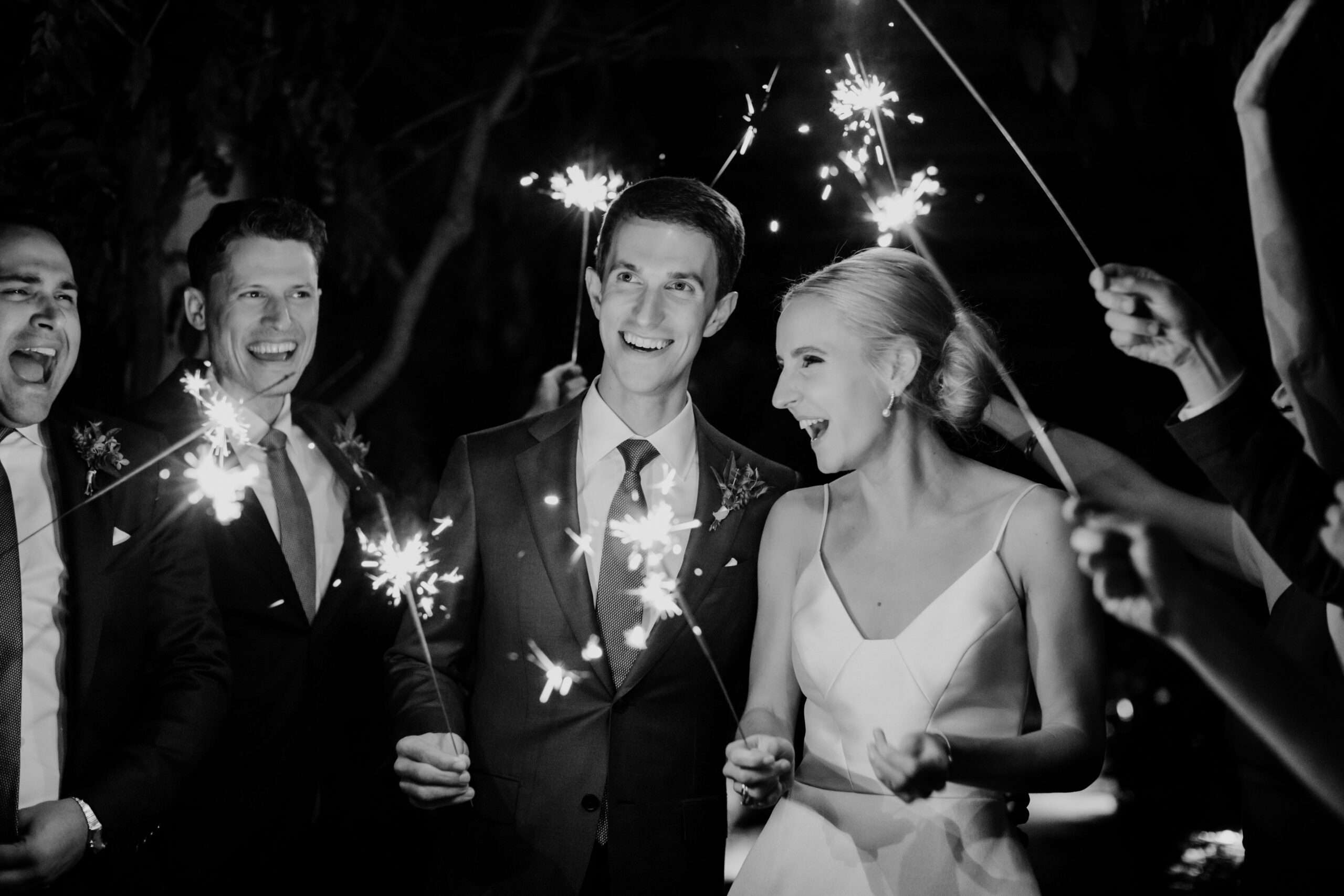 Stunning bride and groom exit under the sparklers after their New York winery wedding