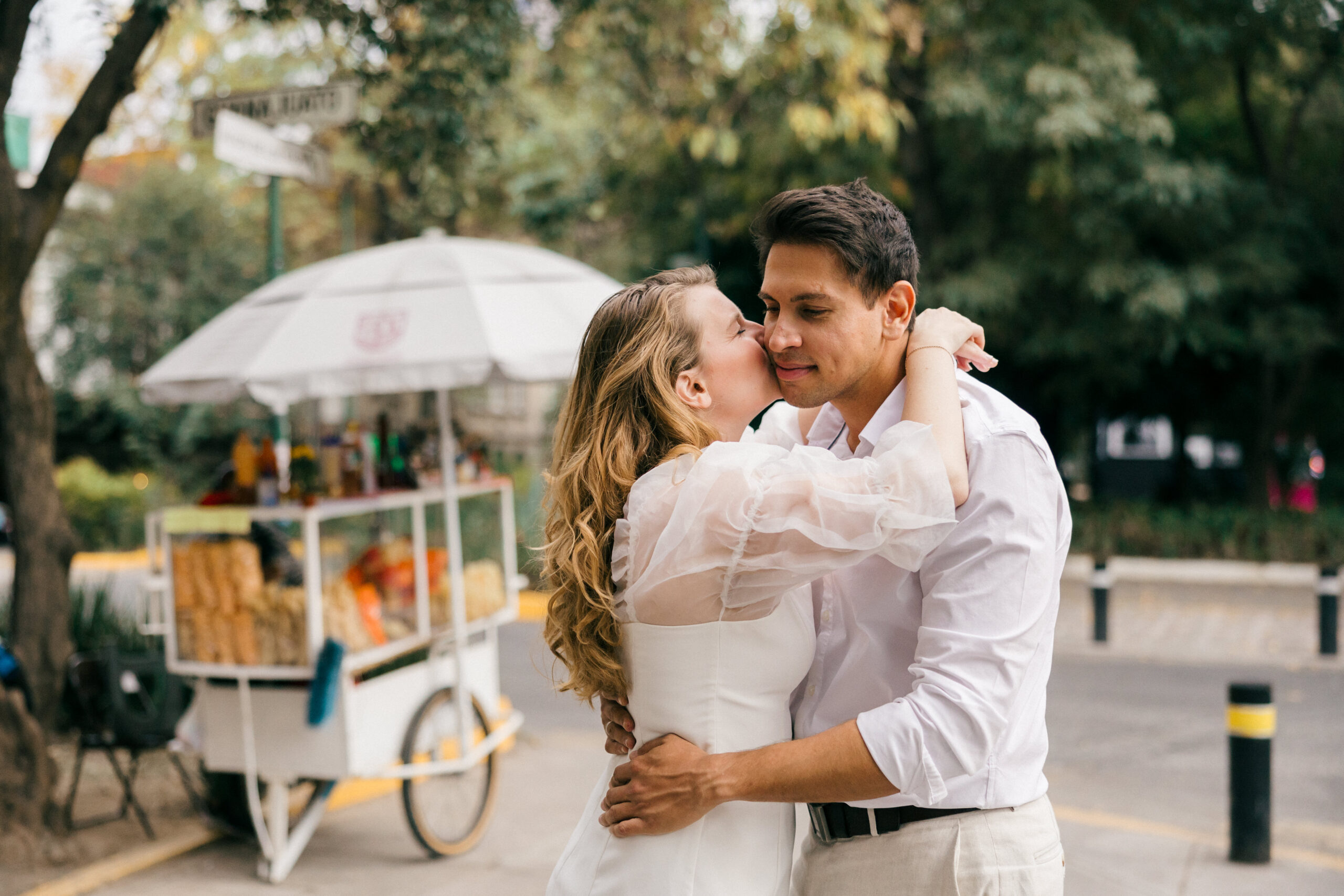 Stunning couple share a kiss together during their Mexico City engagement photos