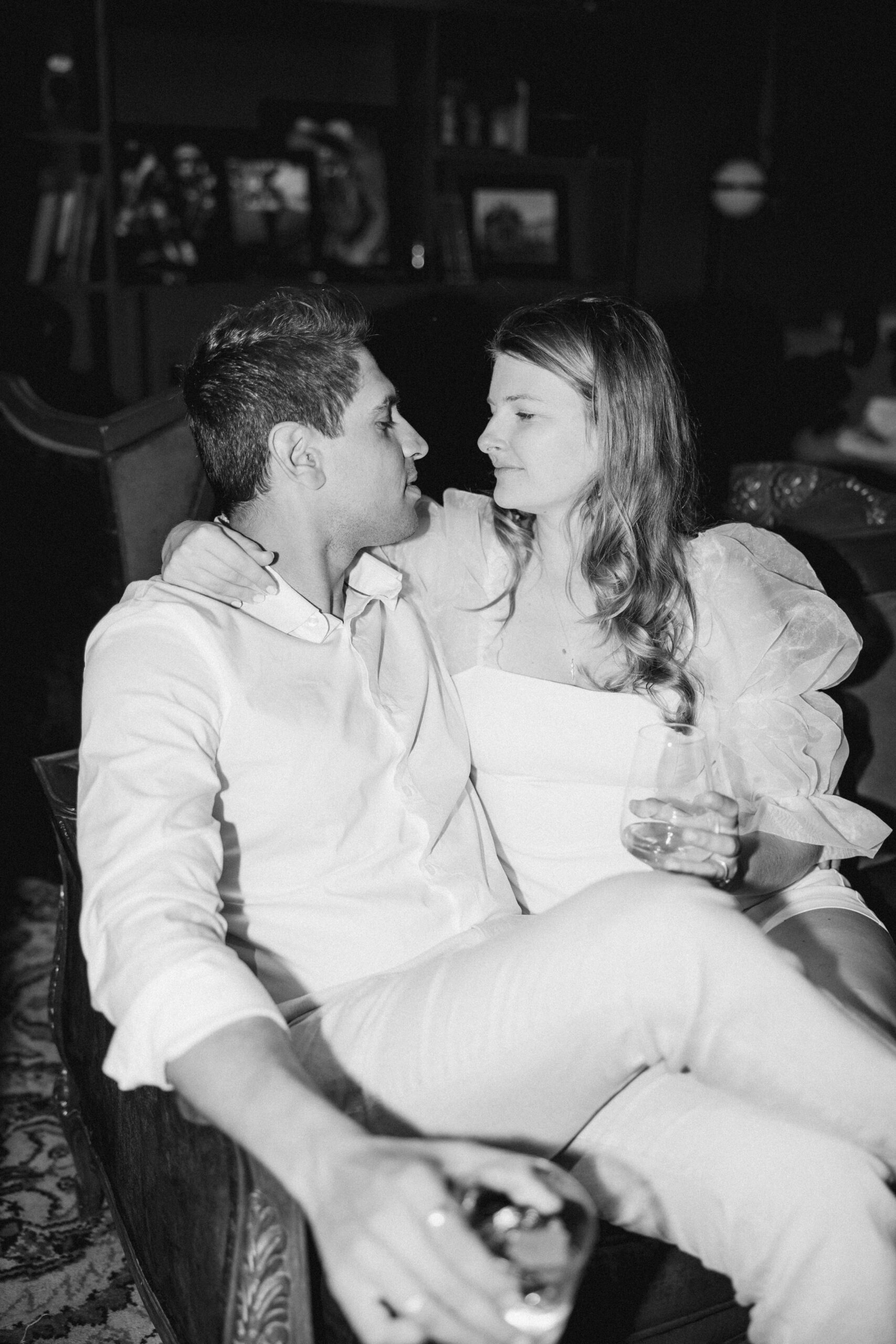 Stunning couple pose on the couch for flash photography during their Mexico city engagement photos