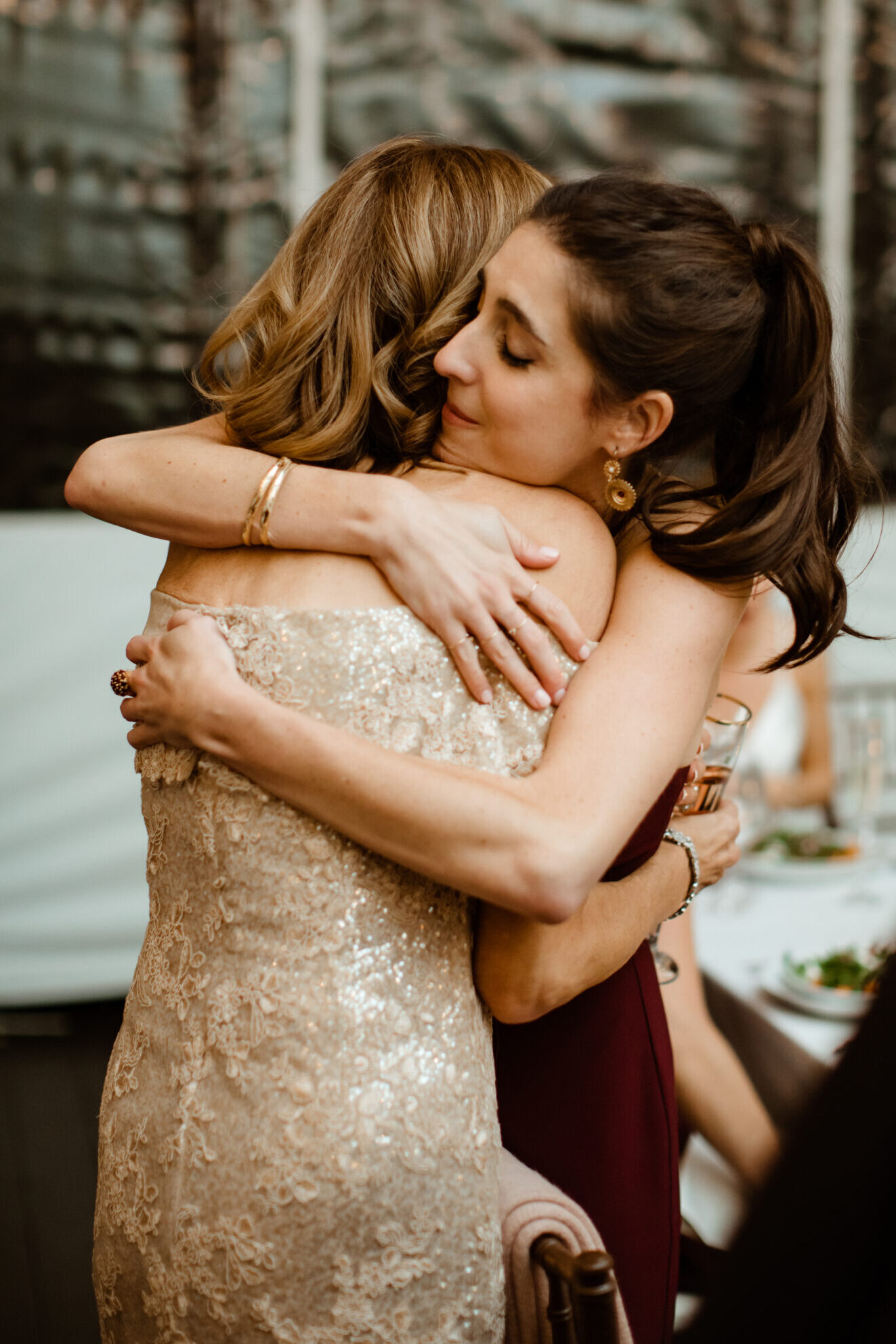 Guests embrace during a dreamy New York winery wedding