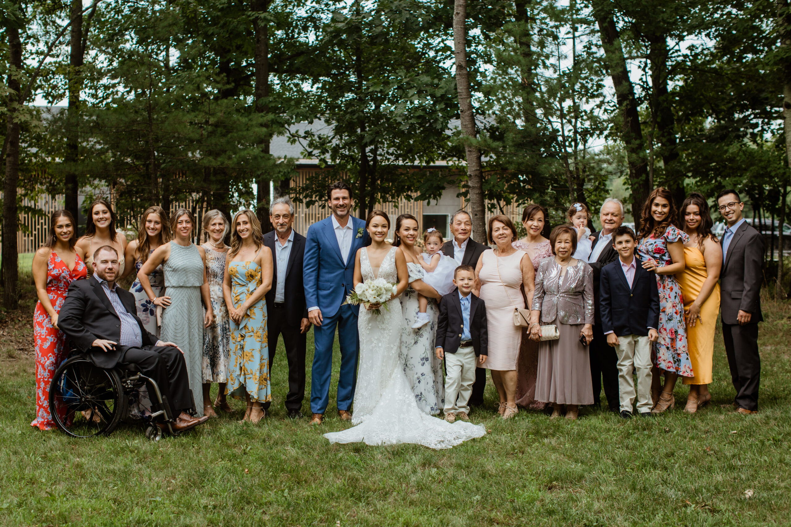 Formal photo of both wedding families posing with the bride and groom 