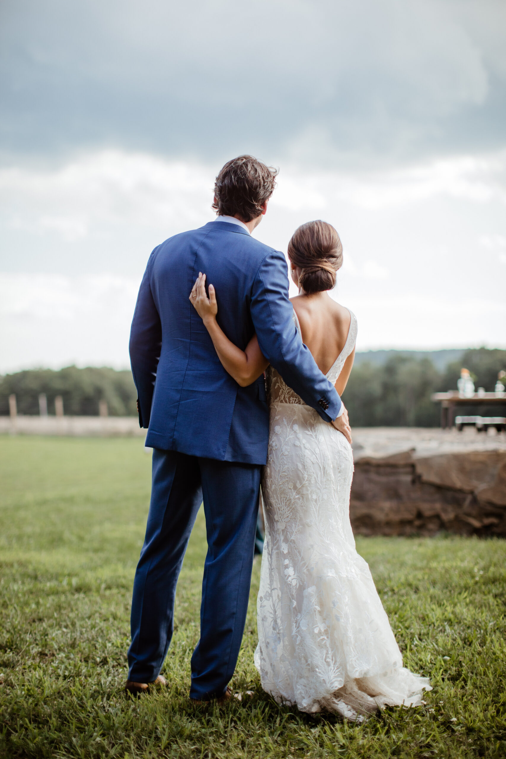Stunning bride and groom overlook their dreamy modern Upstate New York wedding venue