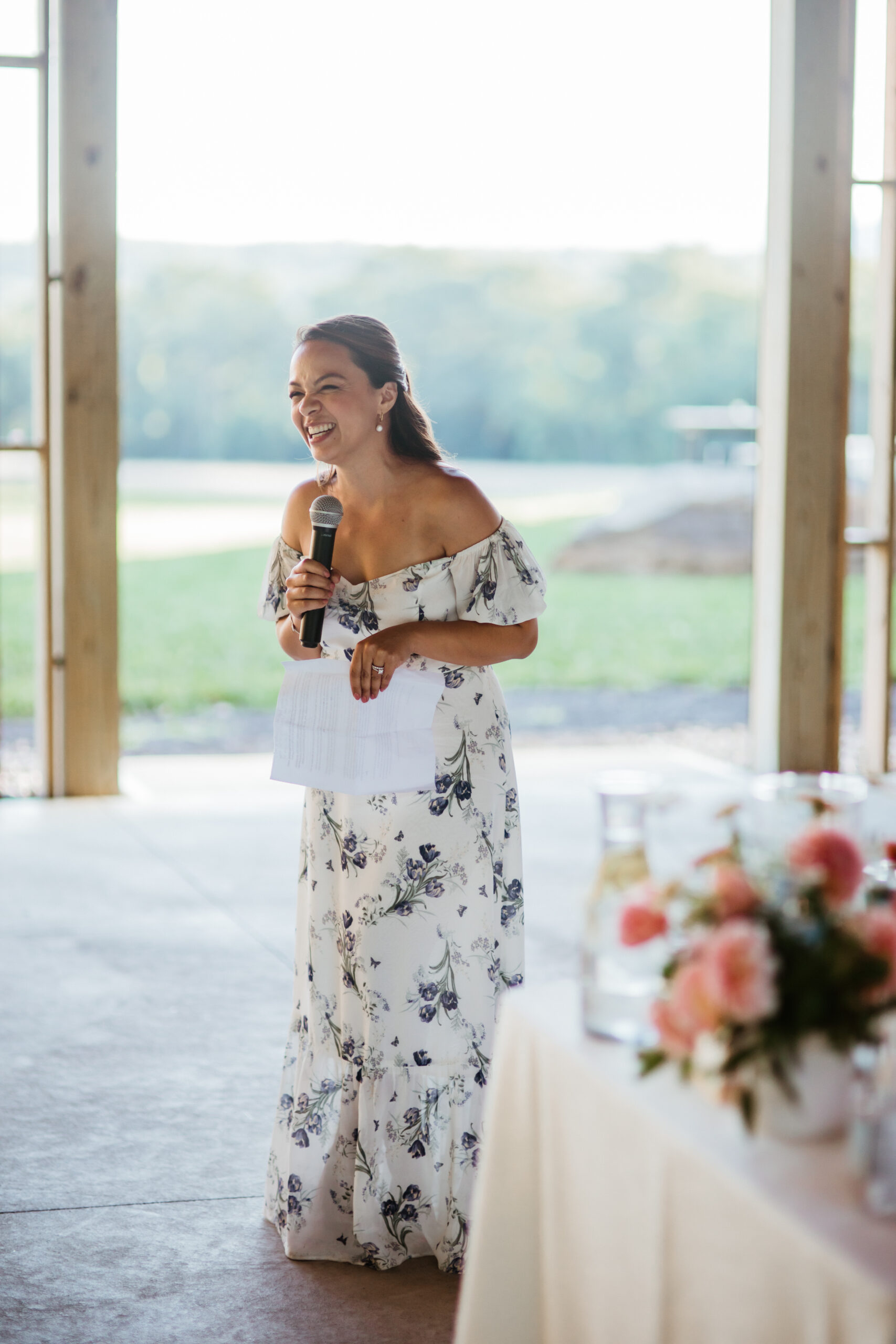 Stunning guest shares a toast on a dreamy Upstate New York wedding day