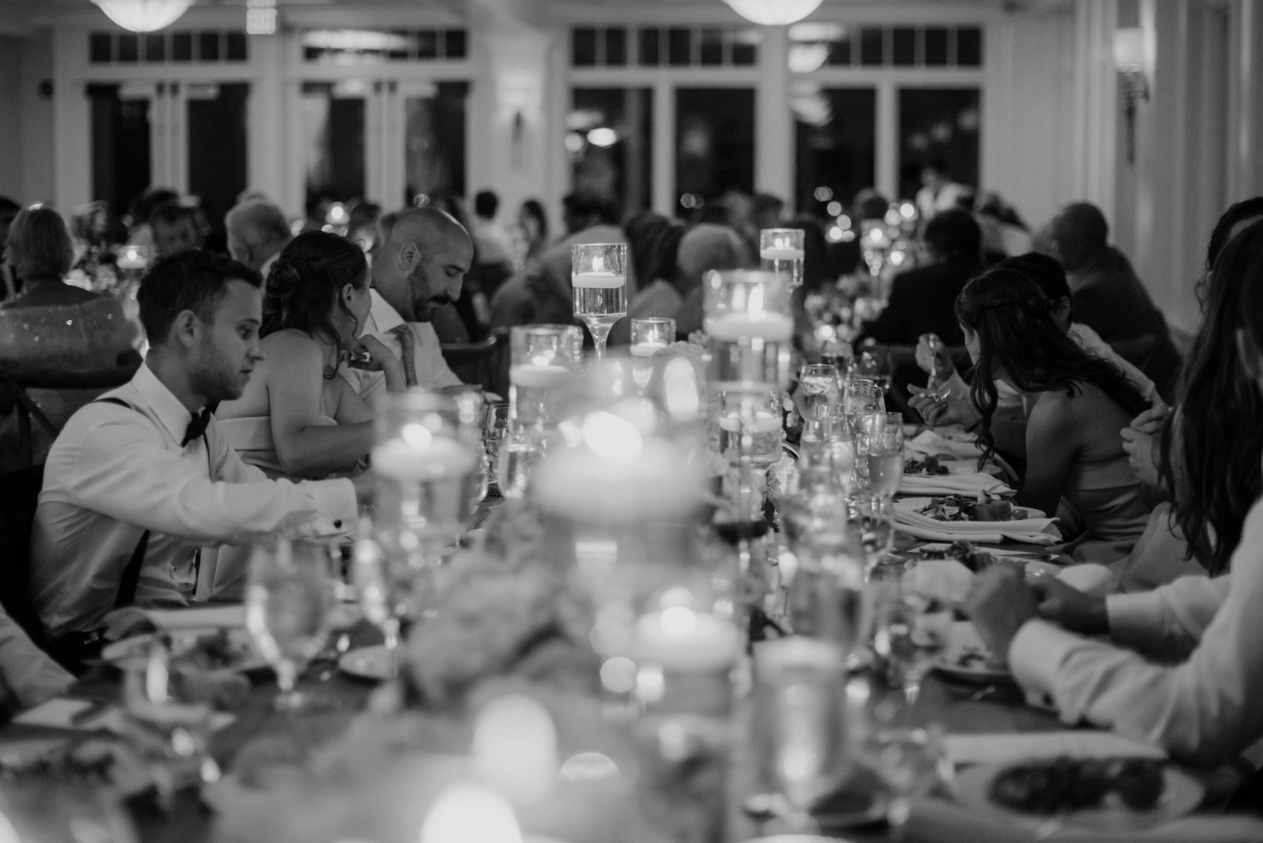 black and white photo of the guests enjoy the reception 