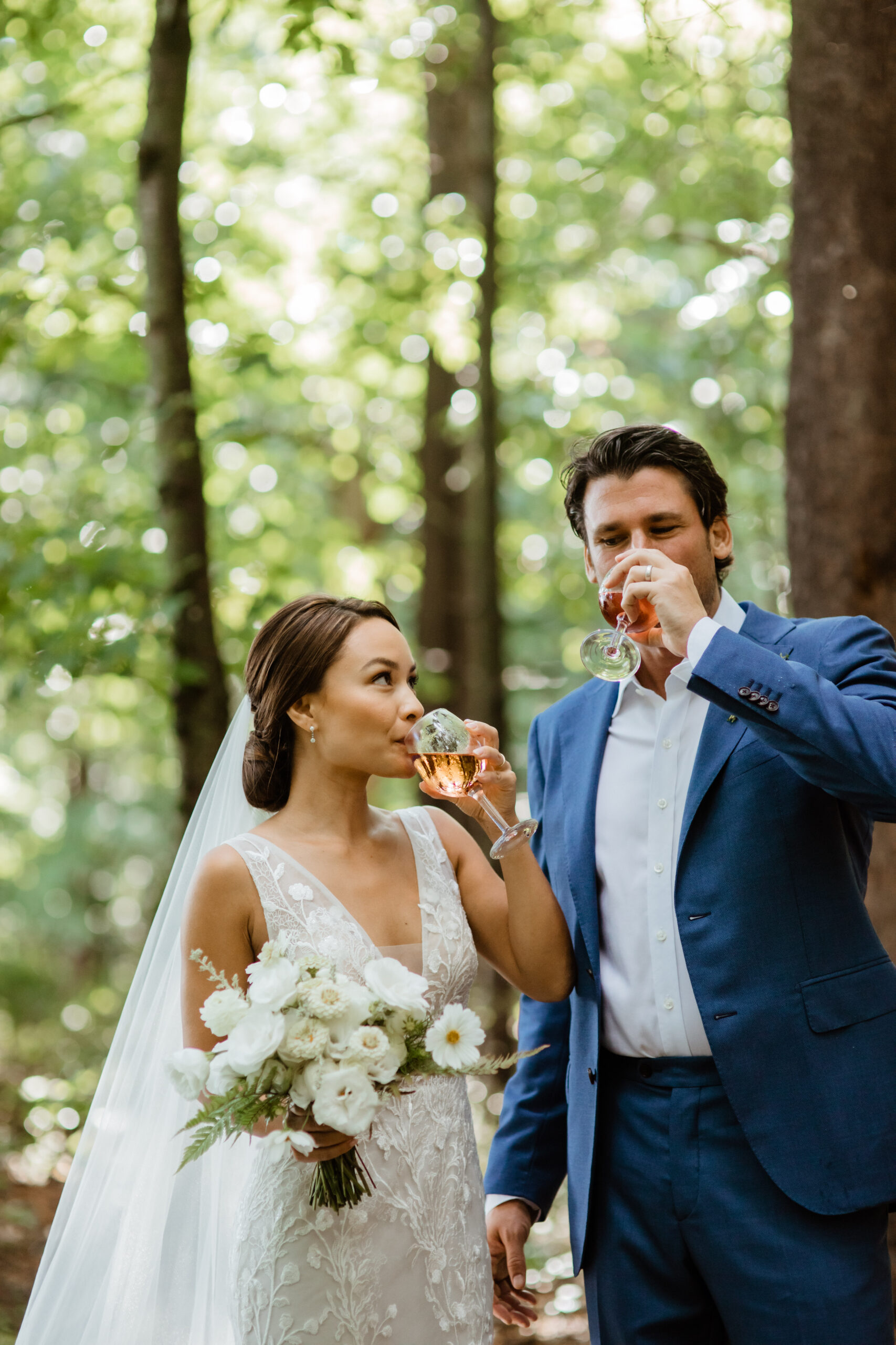 bride and groom sip wine after ceremony
