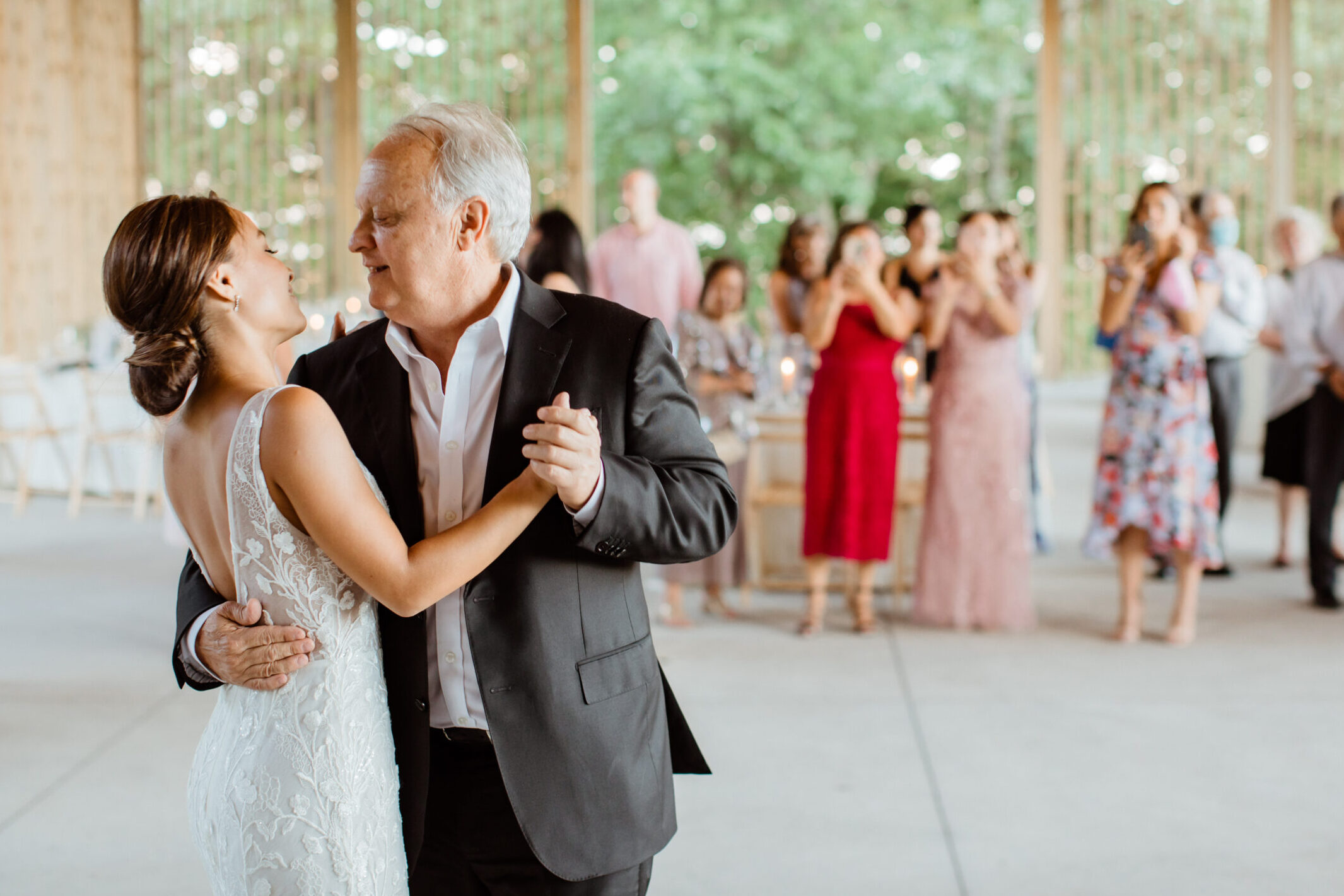 Beautiful bride and her dad share a dance in front of guests during their modern Gather Greene wedding in Upstate New York