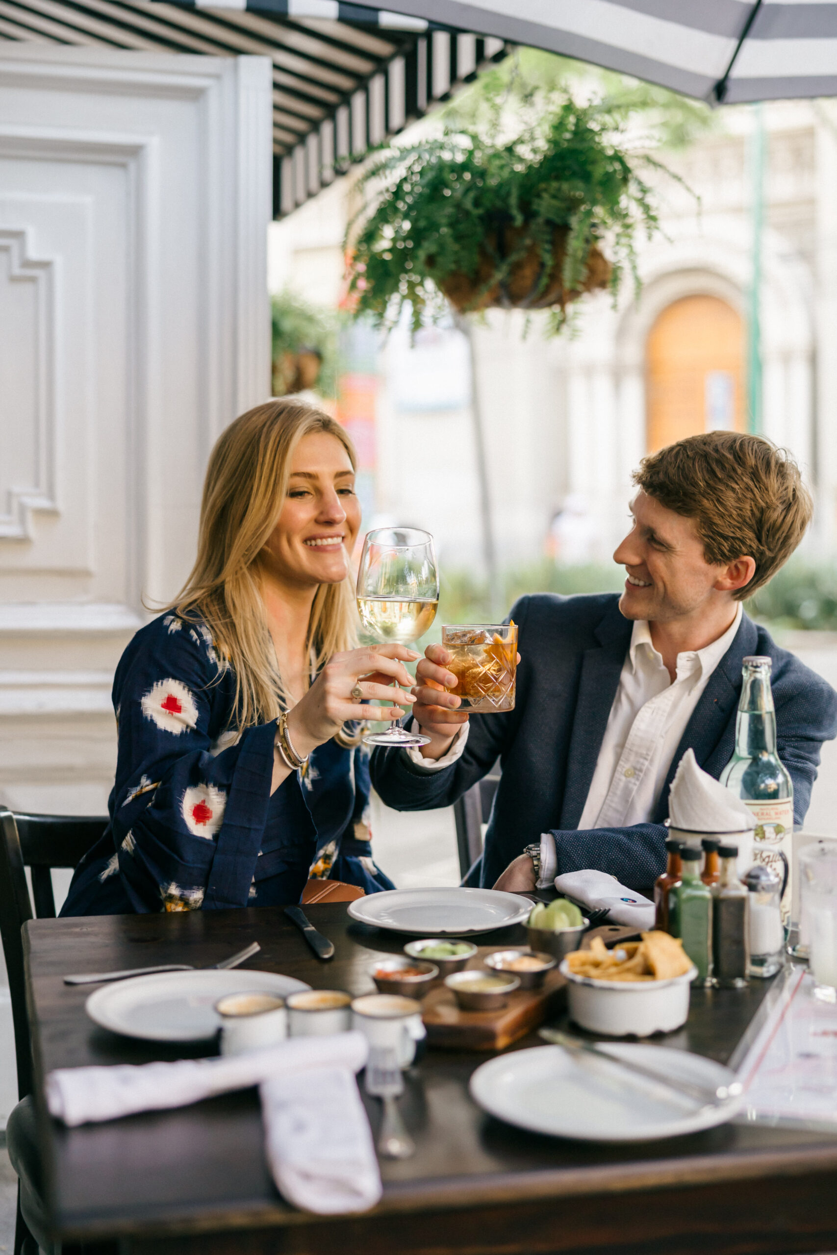 Stunning couple share a laughs and drinks