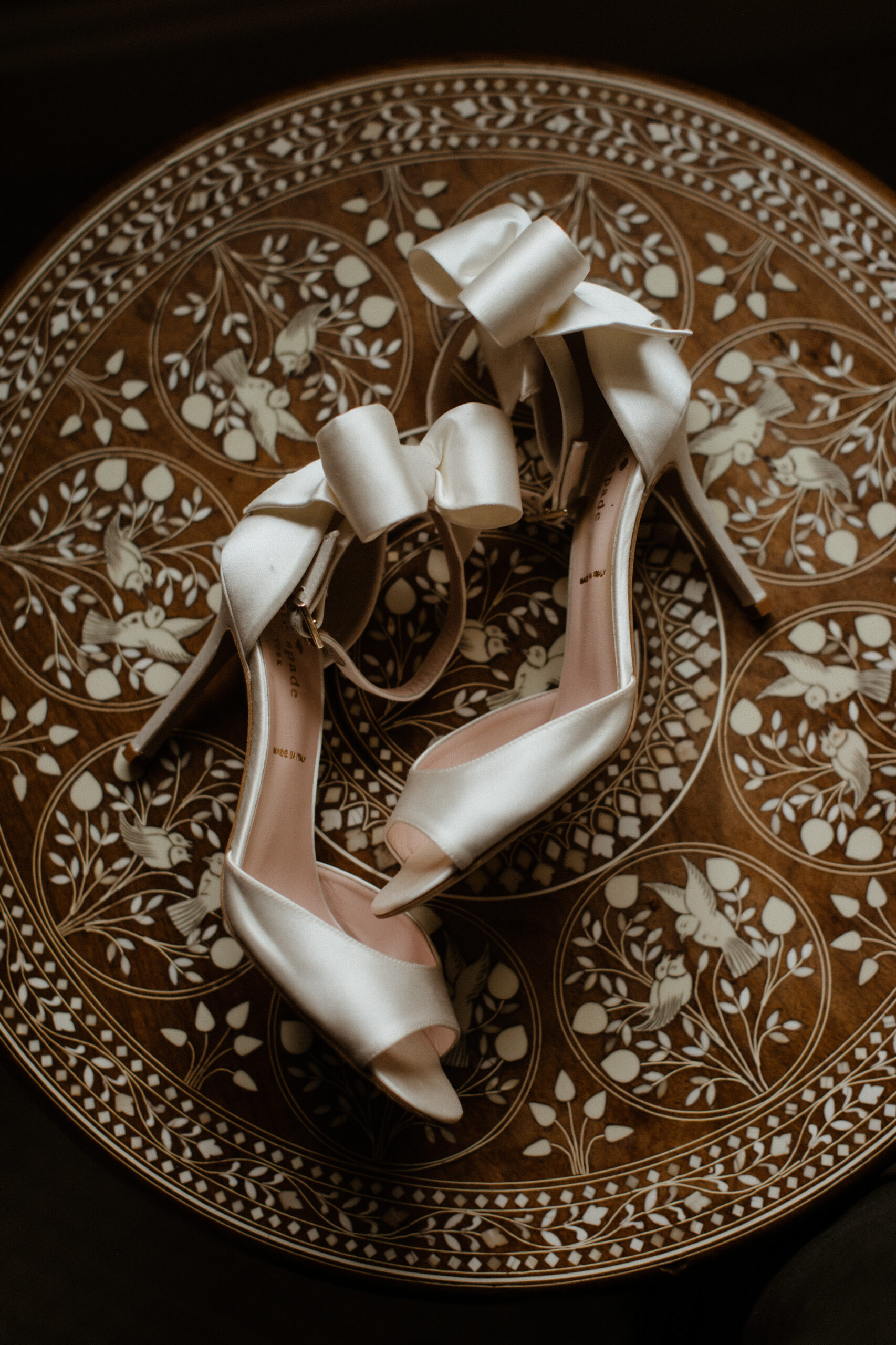 brides shoes lie on the floor ready for the dreamy New York wedding day
