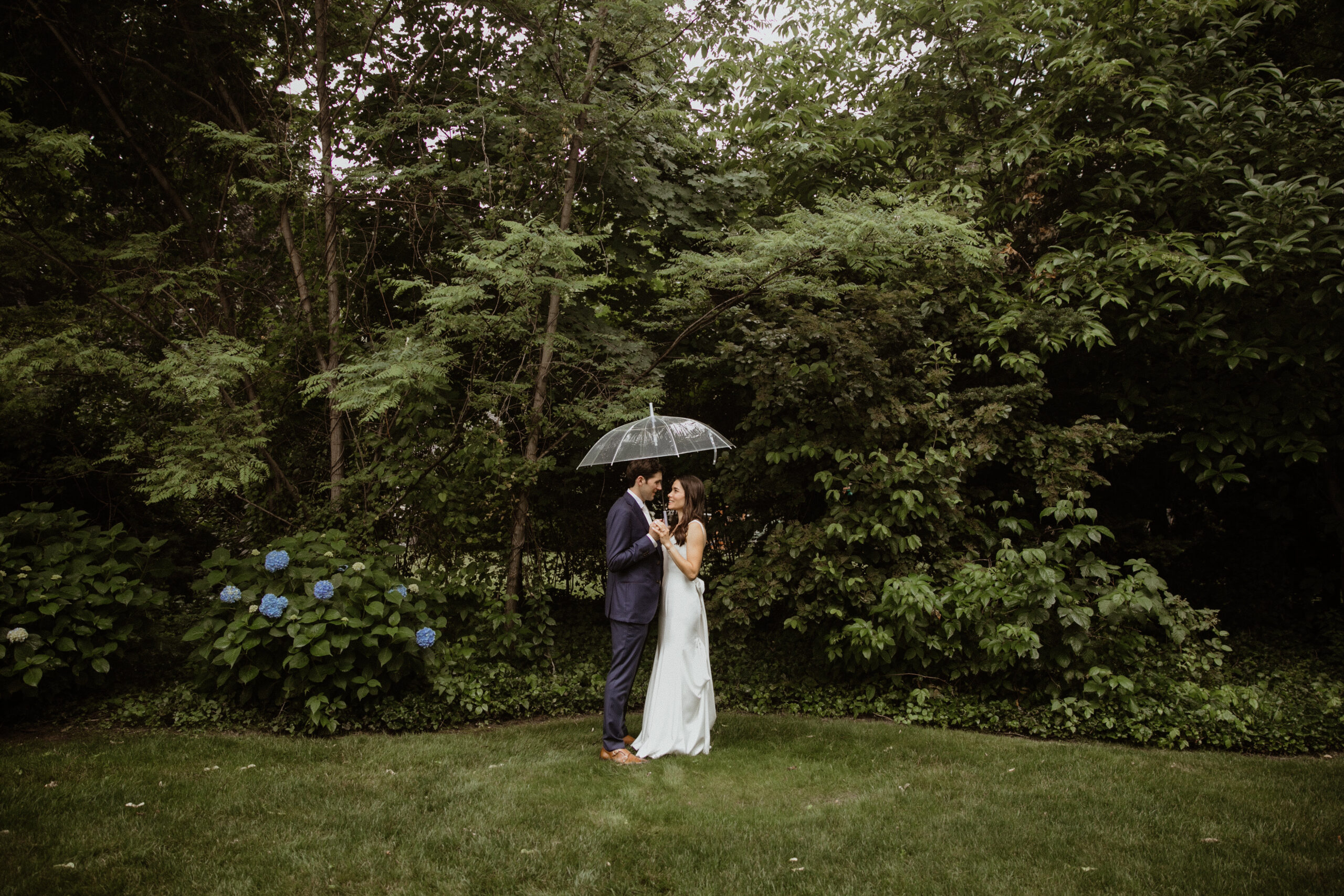 Stunning bride and groom pose together with the Long Island Nature in the background