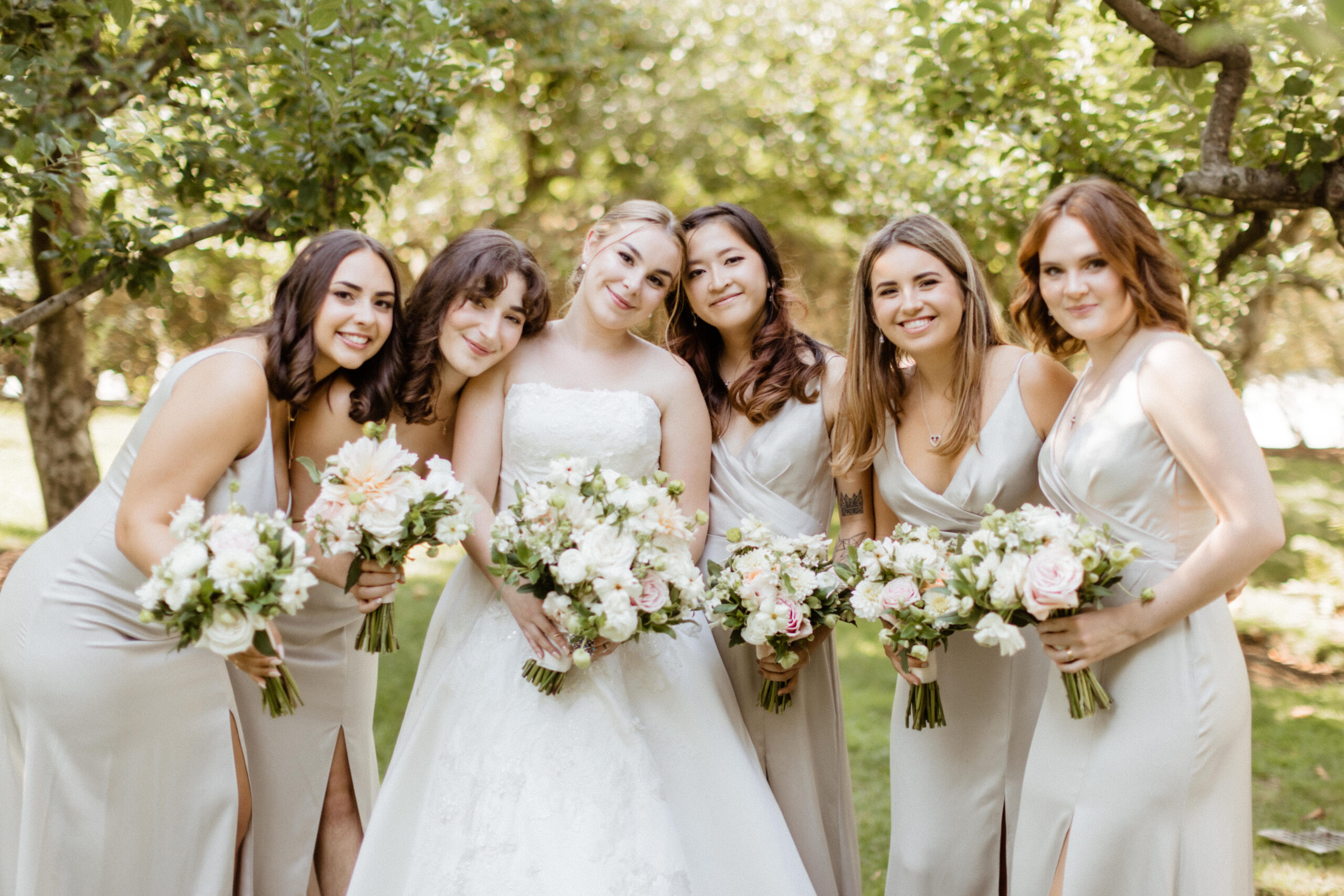 Bride poses with her bridesmaids before her dreamy New York wedding day