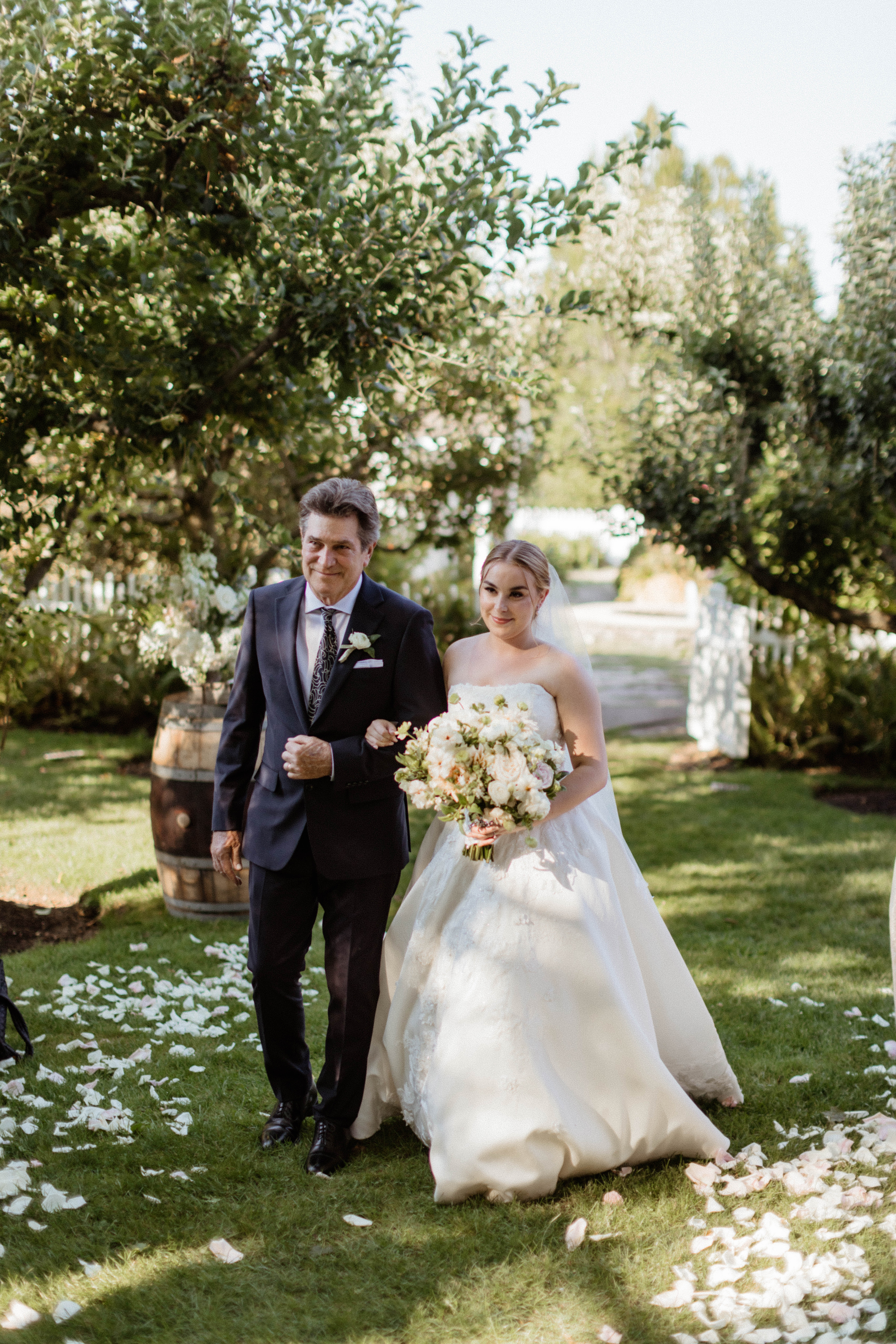 Beautiful bride enters with her dad on her stunning Bedell Winery New York  wedding day