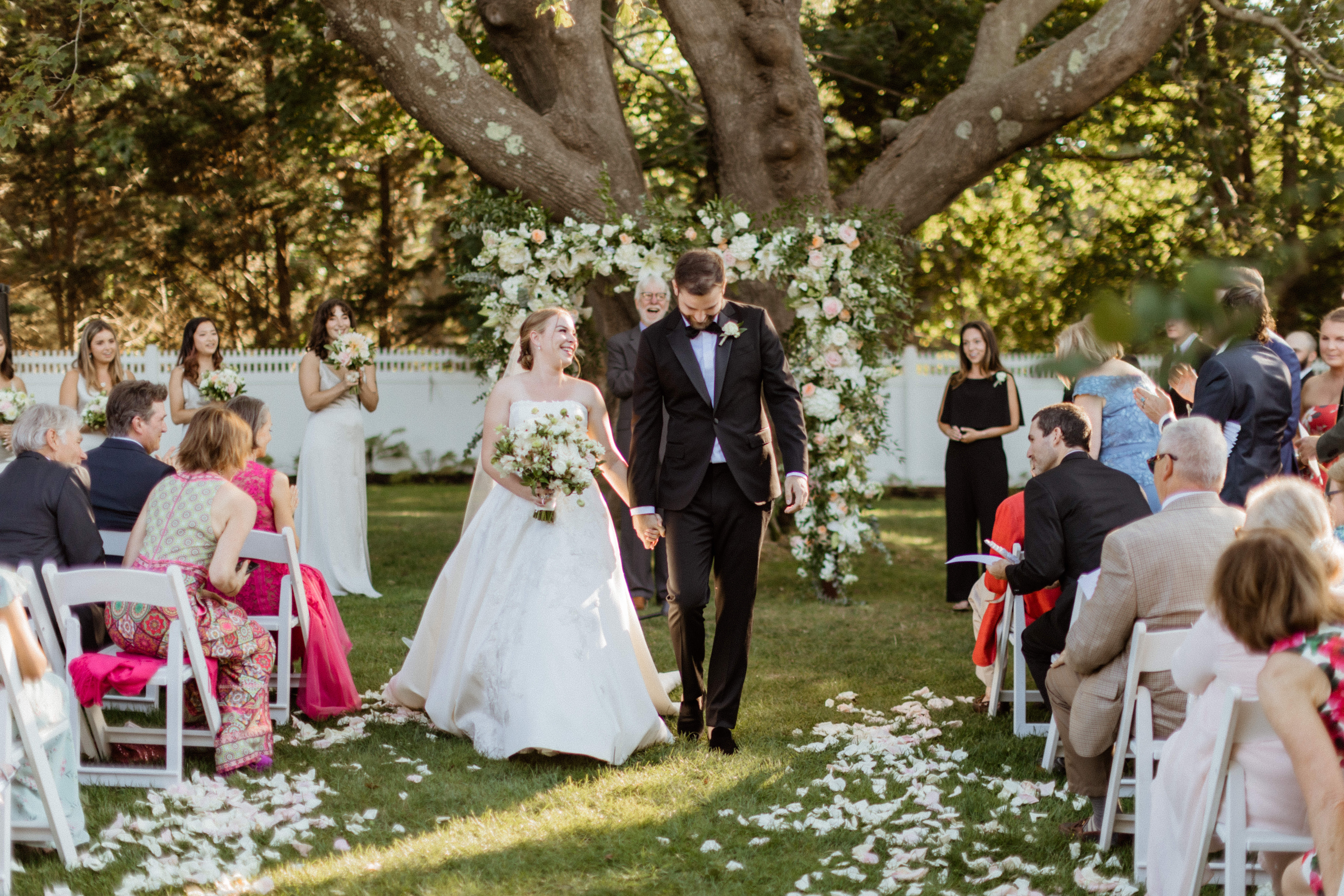 Stunning bride and groom exit their dreamy Bedell Winery, New York wedding ceremony