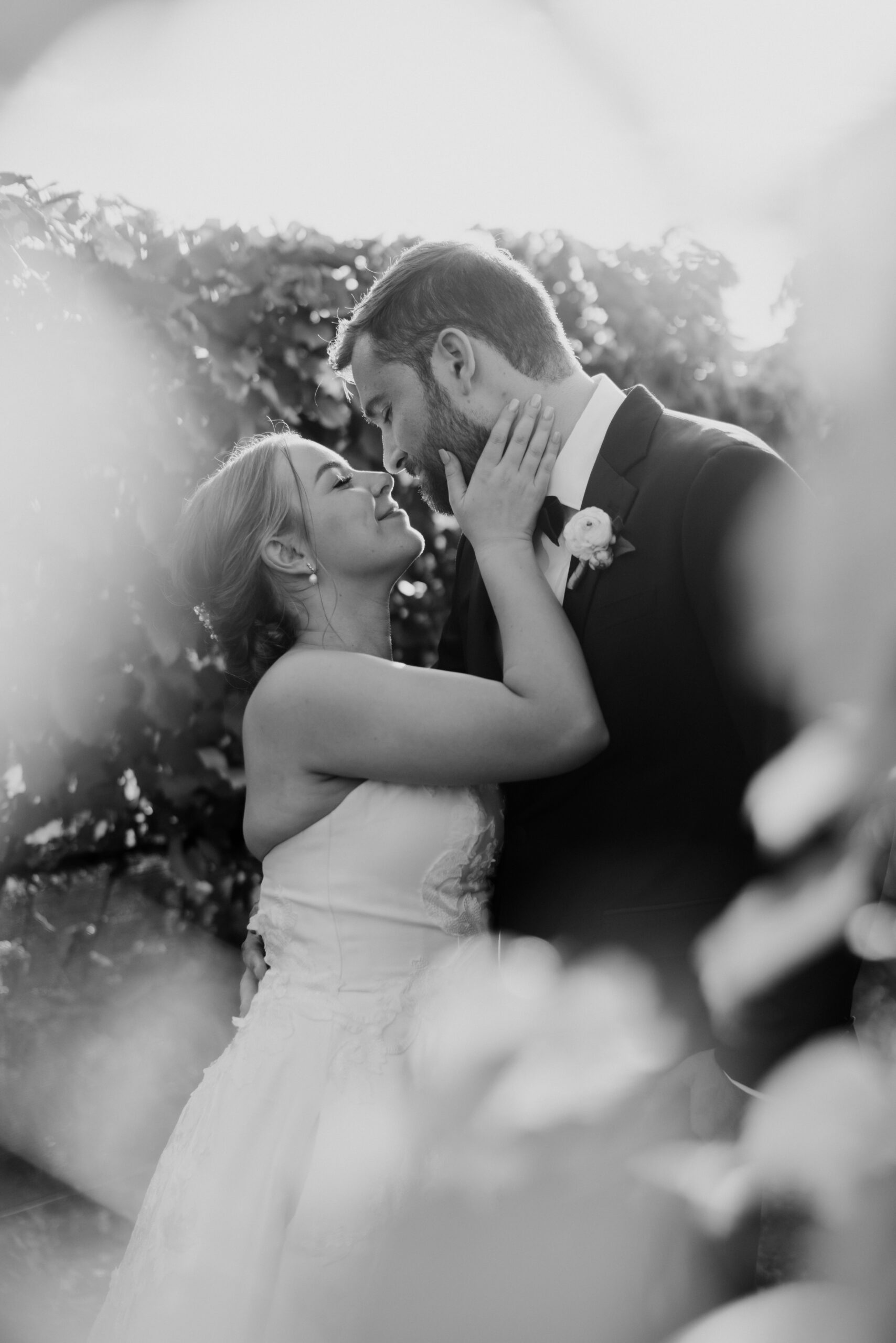 Stunning bride and groom share a kiss on their dreamy Bedell Winery, New York wedding day