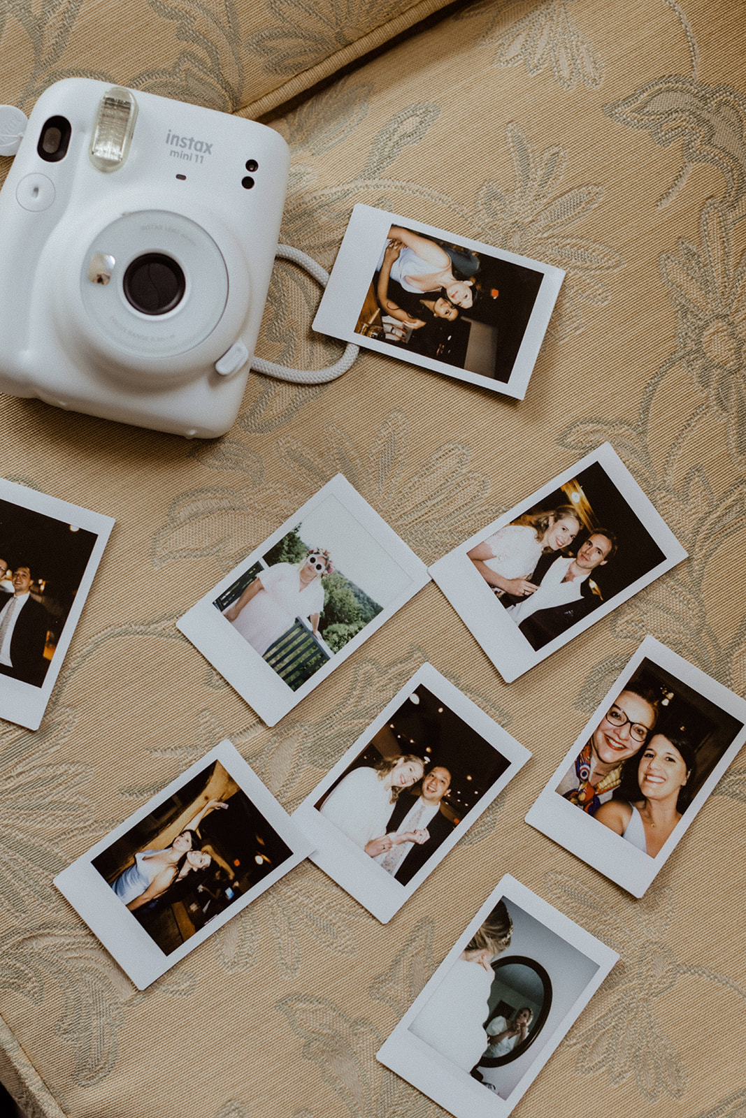 guests take polaroid selfies to share the moment 