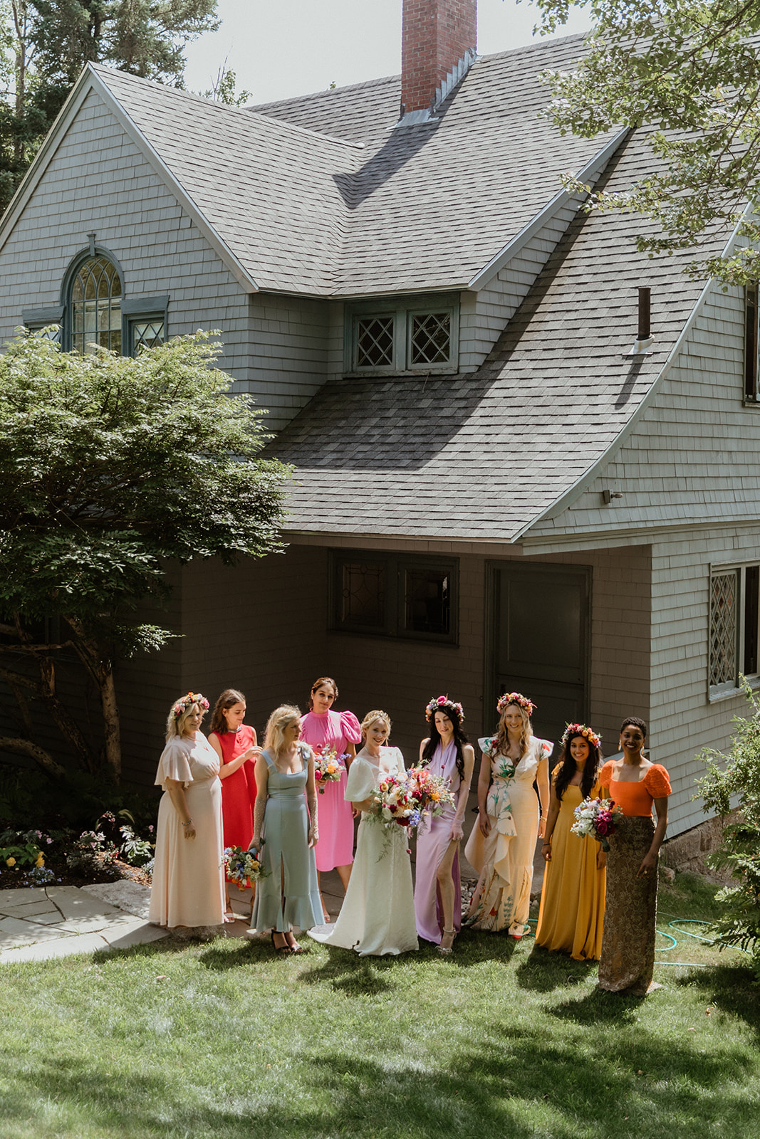 bridesmaids in colorful mismatched dresses in Maine