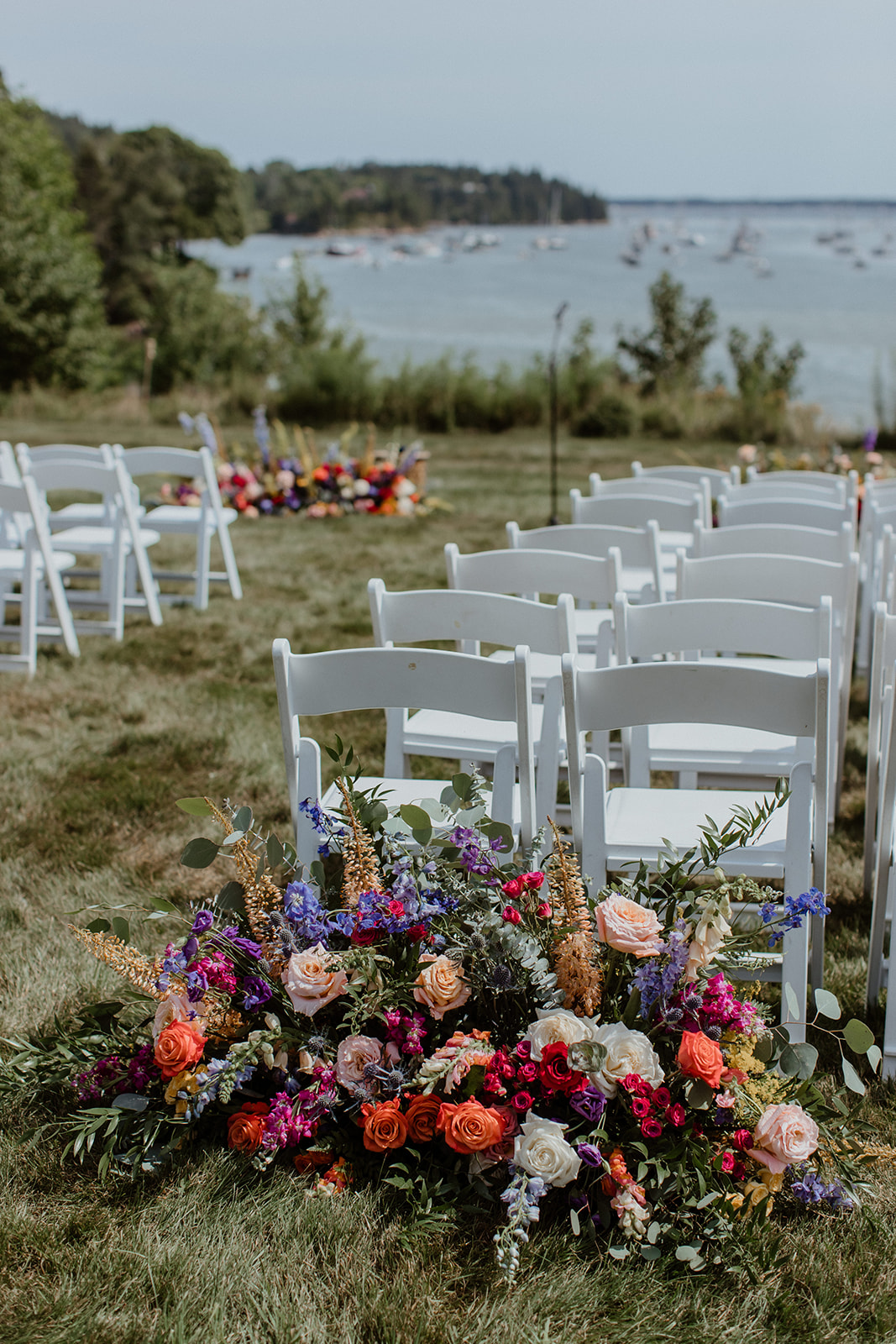 stunning summer Maine wedding ceremony site set up and ready to go for the guests