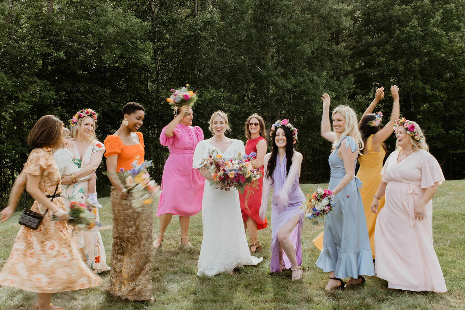 bridesmaids celebrate and dance with the bride after the dreamy summer Maine wedding