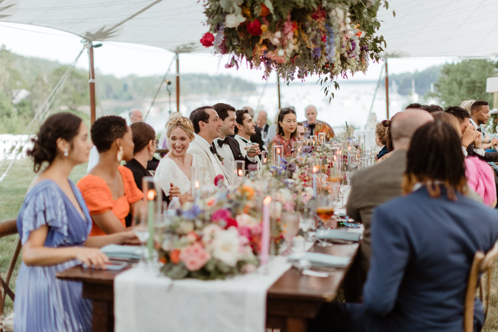 bride and groom share laughs and stories during their seaside Maine wedding reception