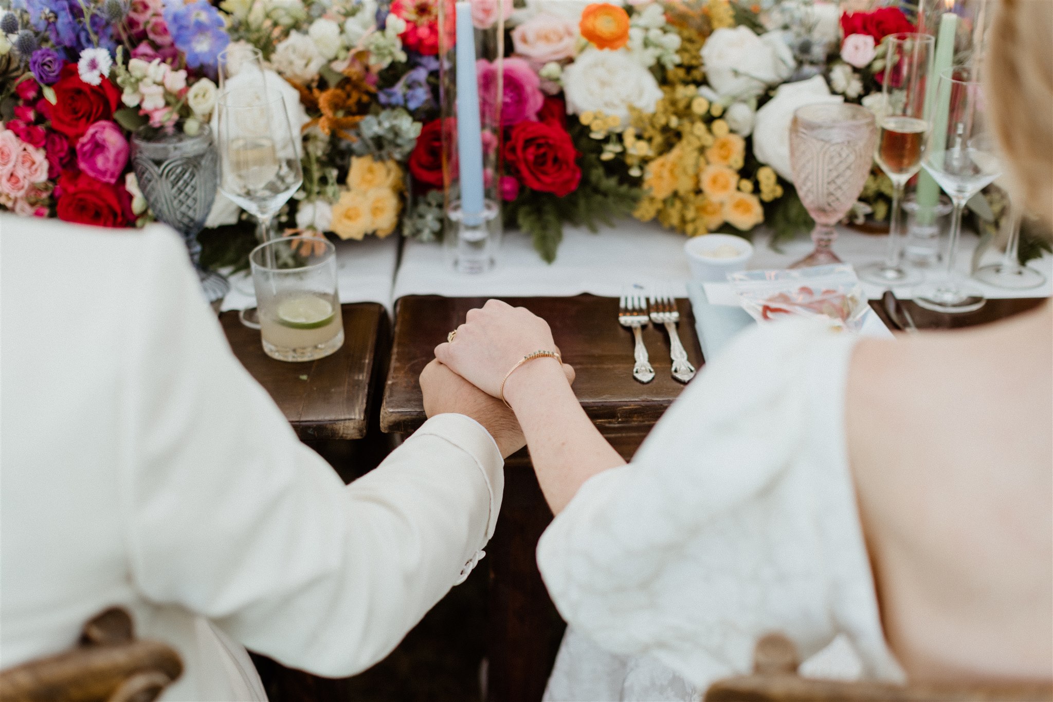 bride and groom hold hands during the stunning Maine wedding reception