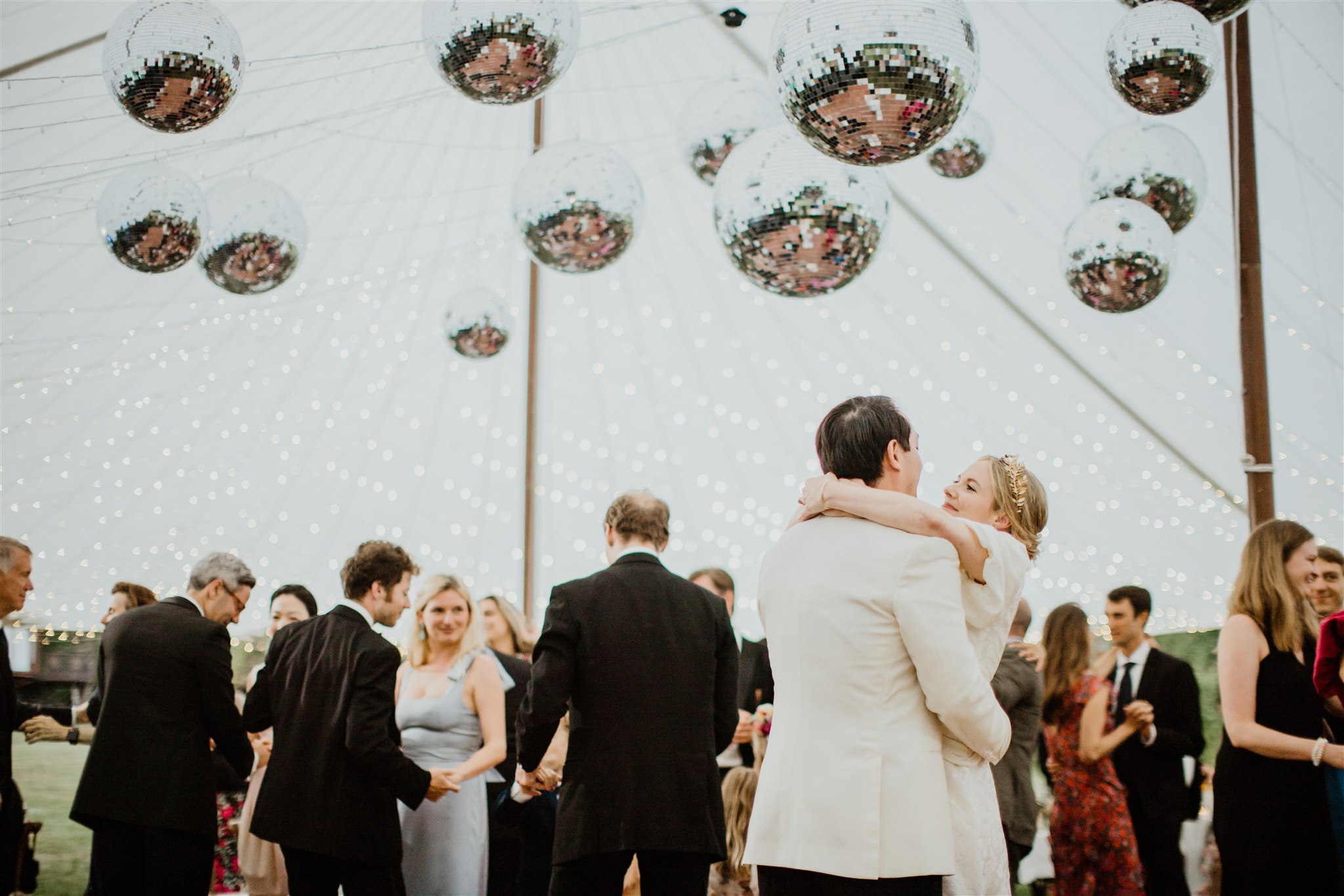 bride and groom share an intimate moment during the dreamy Maine wedding reception