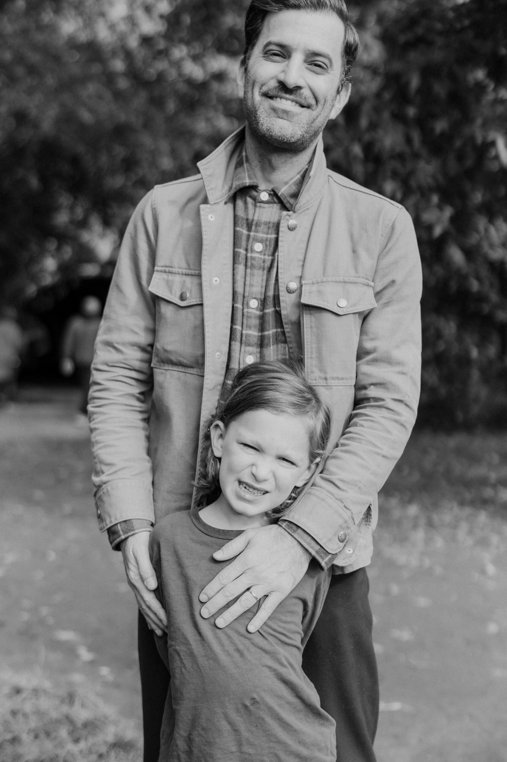 Dad poses with his kids during their families NYC family photoshoot
