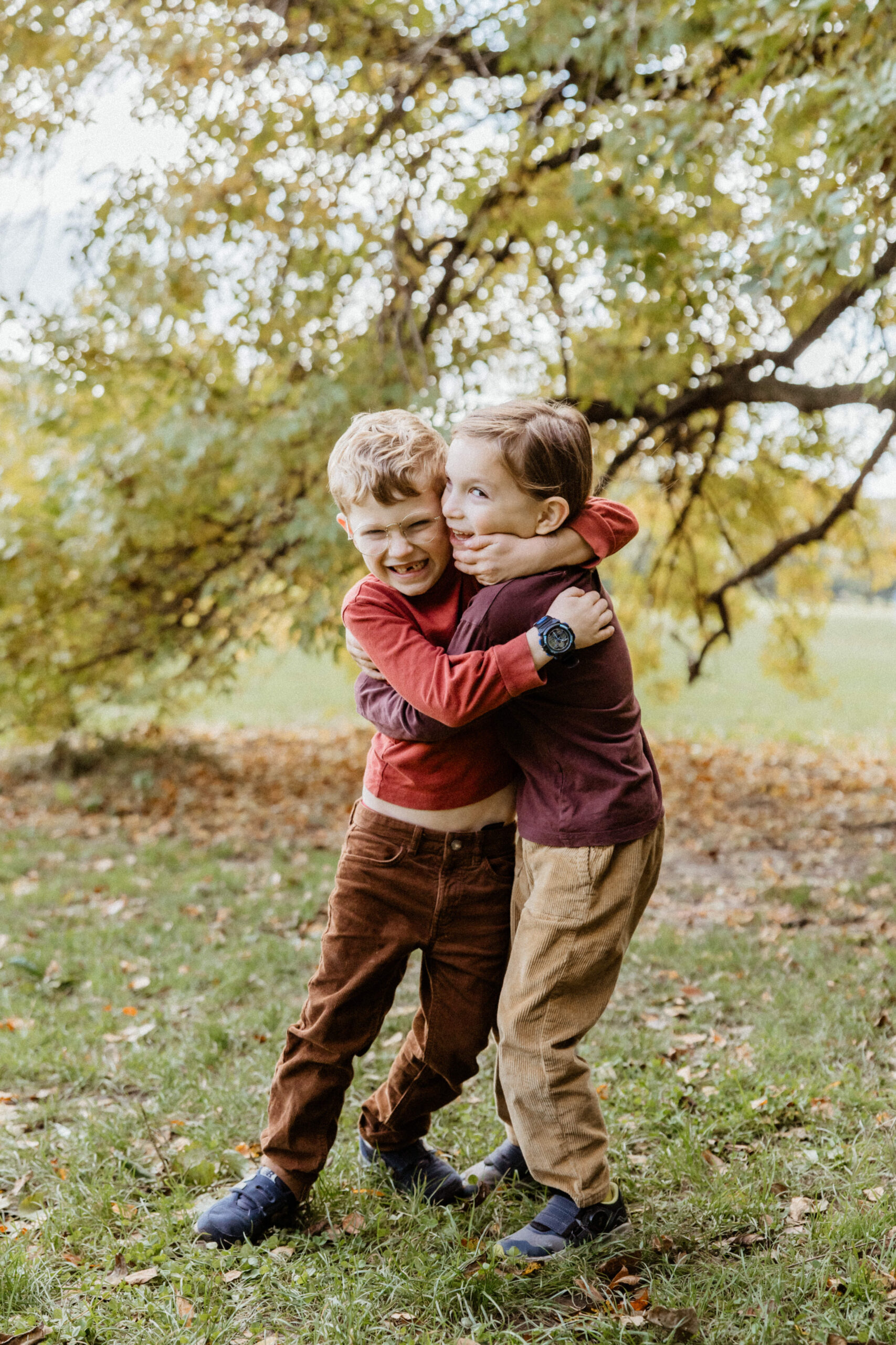 Loving siblings pose together during their NYC family photoshoot