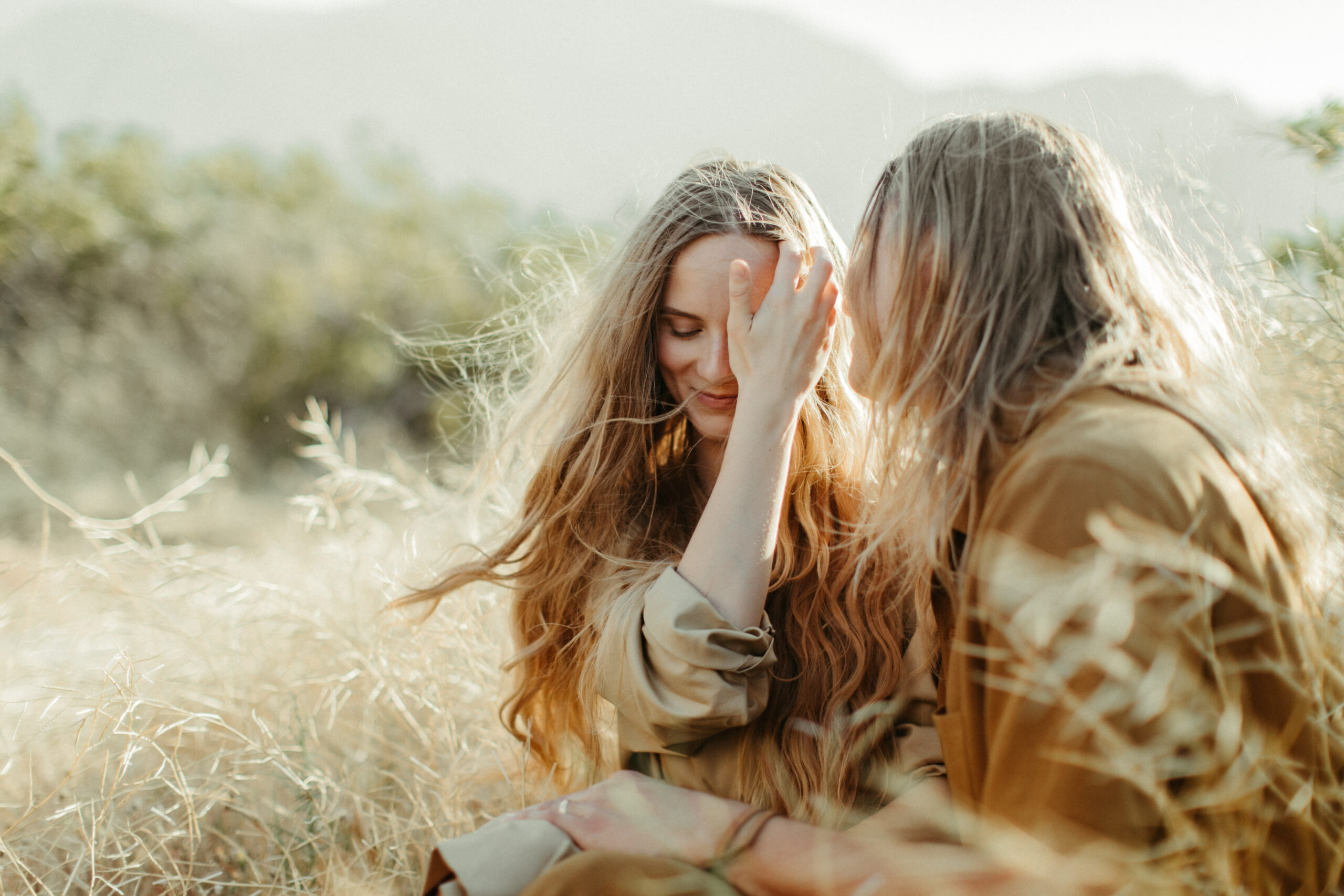 beautiful couple pose in a stunning California field during their engagement photos