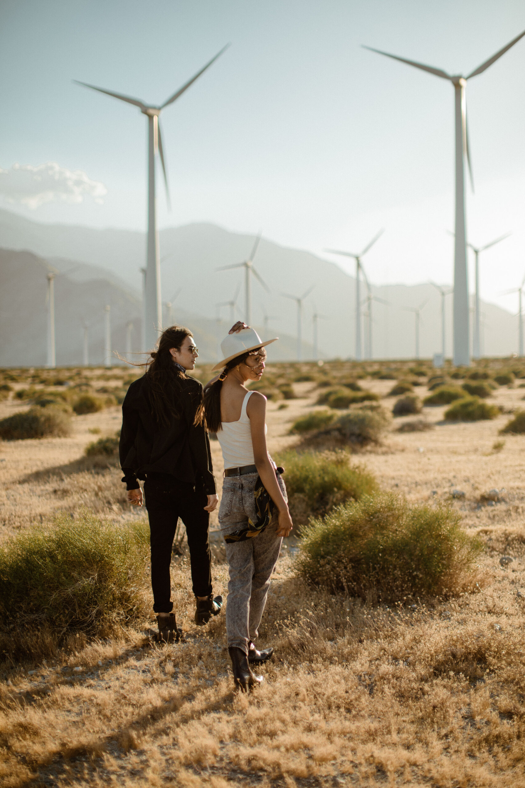 couple pose during their romanticism desert engagement photos