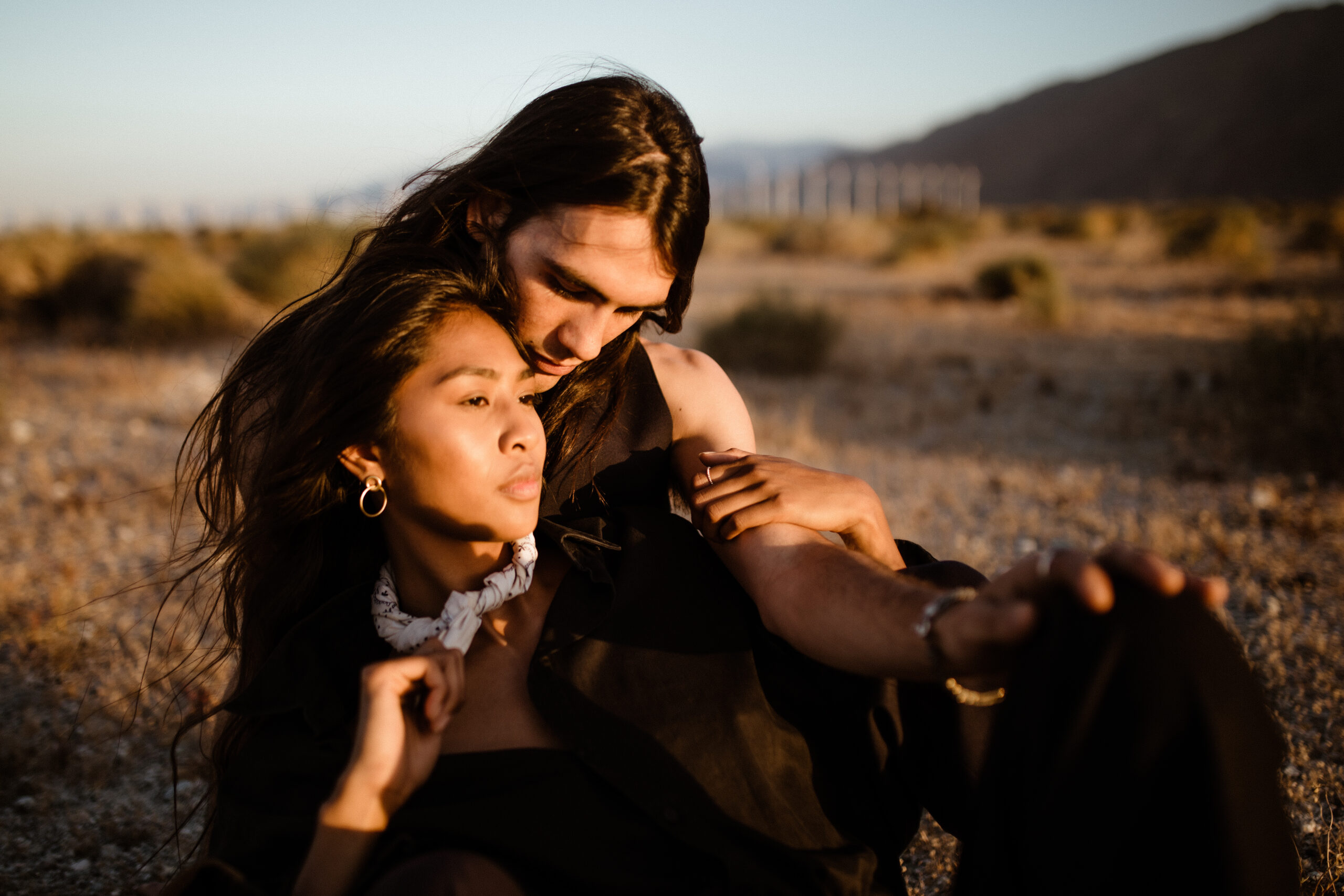 stunning couple pose together during their desert engagement photoshoot