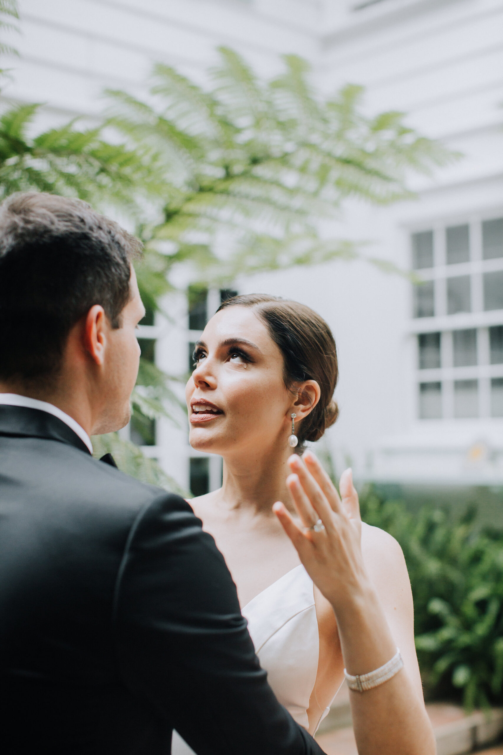 bride and groom share candid emotions during their lush garden Los Angeles first look wedding photos 