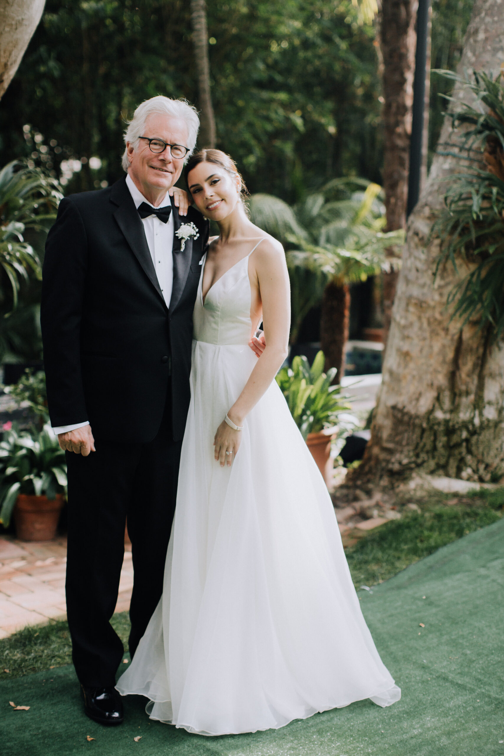 bride poses with her father before her backyard LA wedding day 